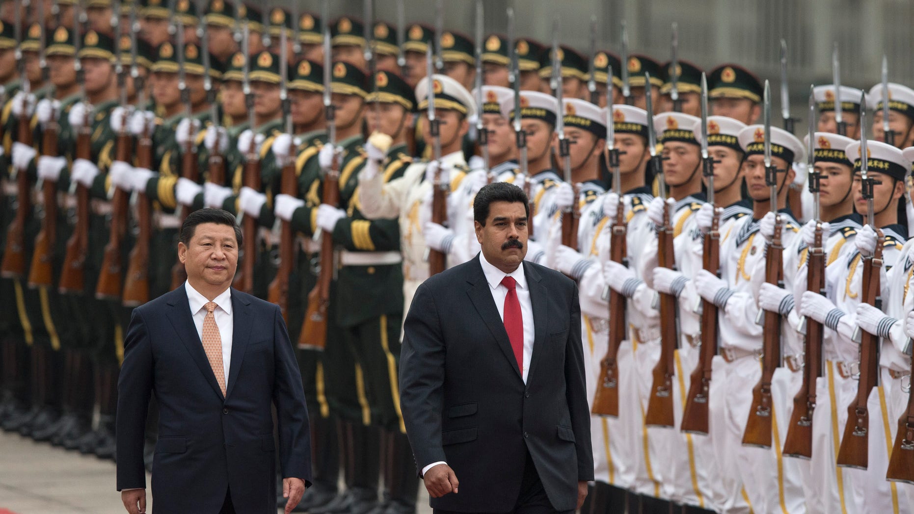 Presidents Xi Jinping and Nicolas Maduro during a ceremony outside the Great Hall of the People in Beijing, China, Sept. 22, 2013.