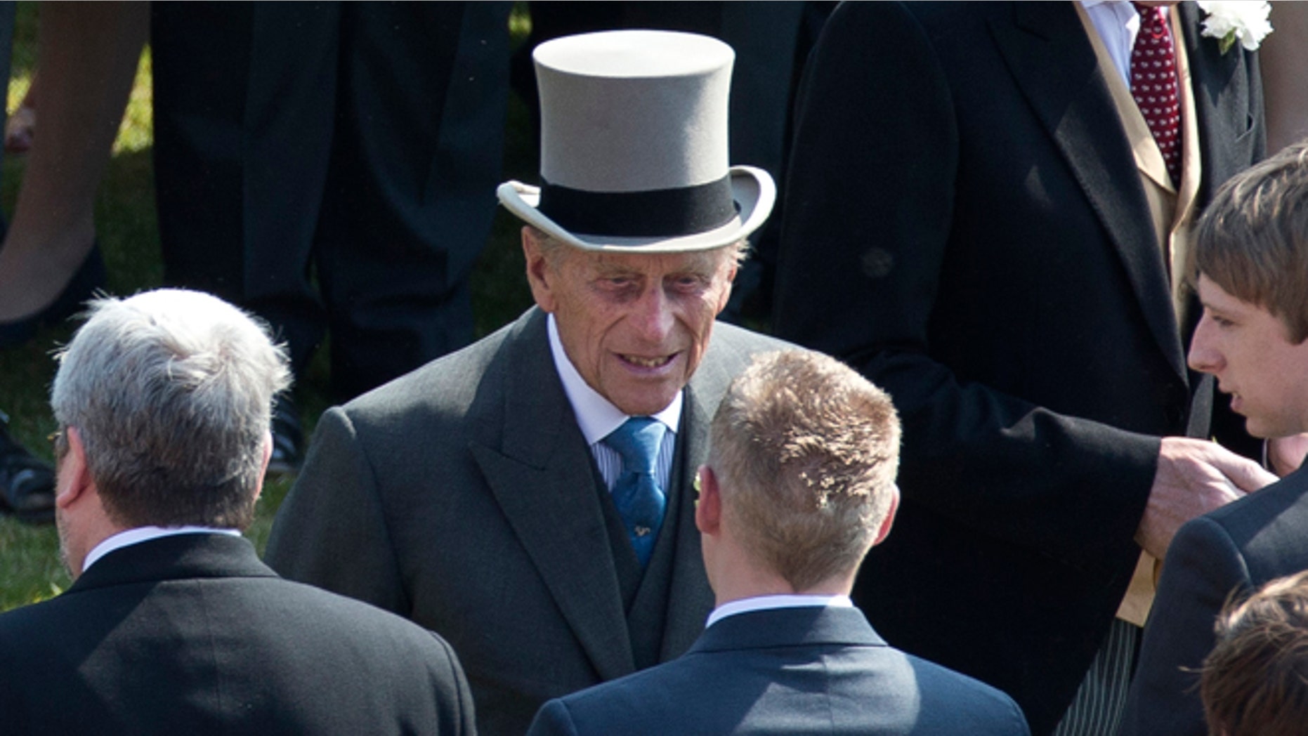 June 6, 2013: Prince Philip, center, the husband of Britain's Queen Elizabeth II attends a garden party at Buckingham Palace in London. Buckingham Palace says Queen Elizabeth II's husband was later admitted to a London hospital for an exploratory operation. The palace said the operation on 91-year-old Prince Philip will come after "abdominal investigations," but did not elaborate. (