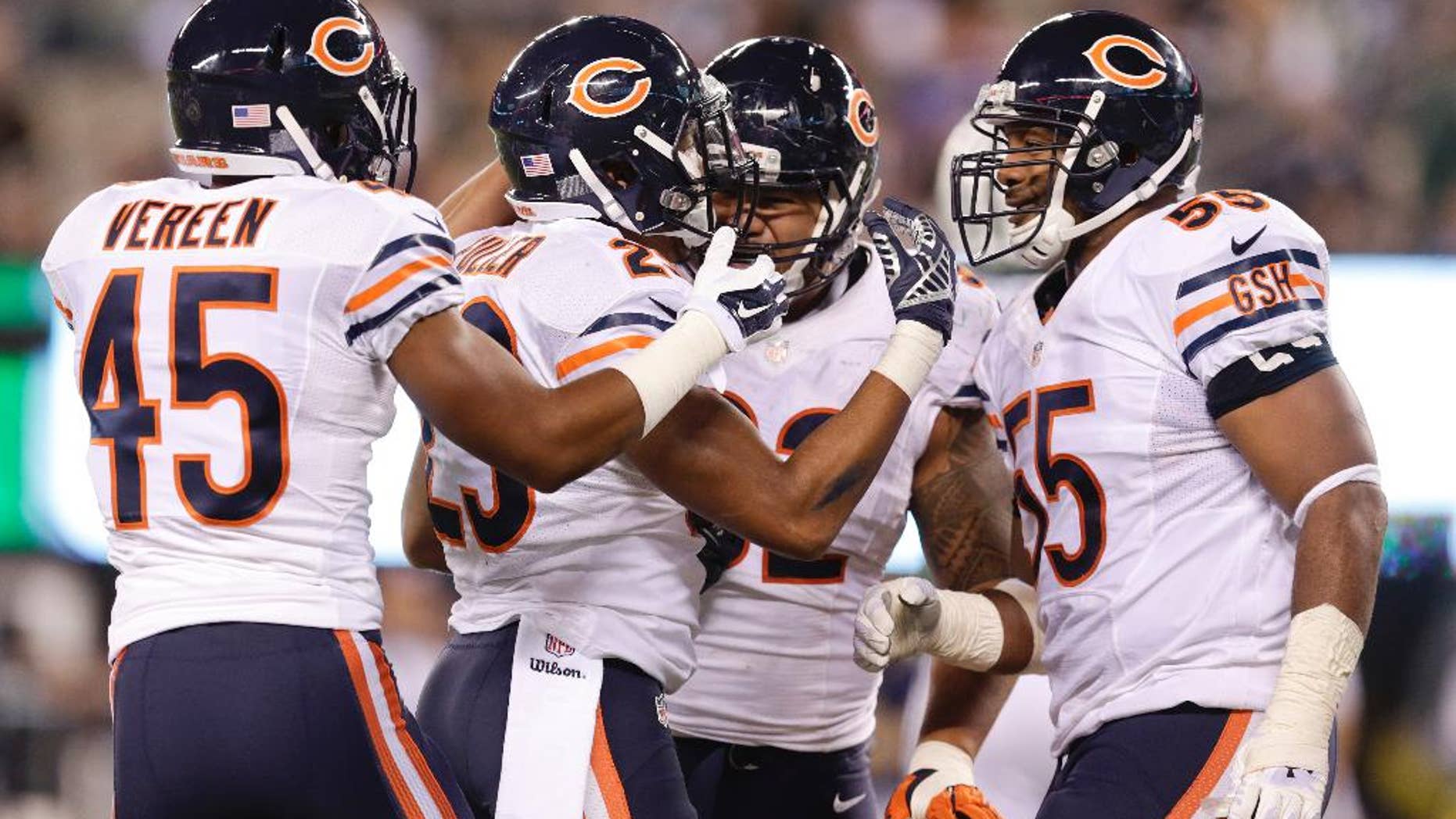 Chicago Bears cornerback Kyle Fuller (23) celebrates with teammates after intercepting a pass in the end zone against the New York Jets during the third quarter of an NFL football game, Monday, Sept. 22, 2014, in East Rutherford, N.J. (AP Photo/Julio Cortez)