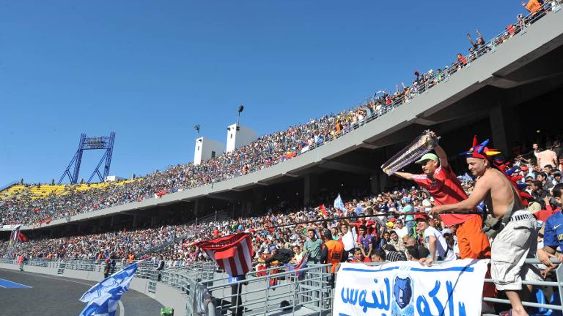 Supporters watch Athletico Madrid play Raja de Casablanca Tangier stadium on April 26, 2011