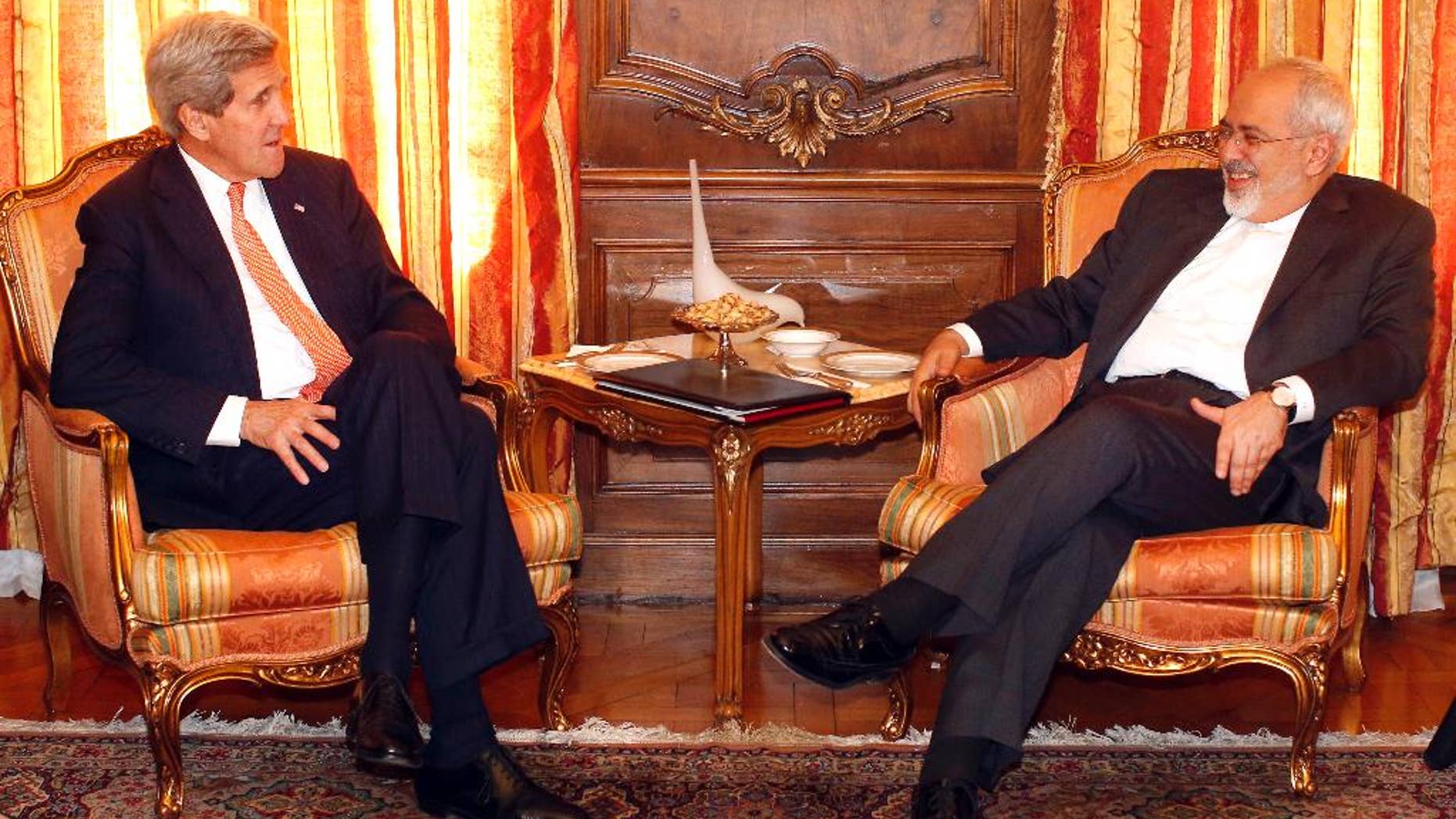 U.S. Secretary of State John Kerry, left, meets with Iran's Foreign Minister Mohammad Javad Zarif, Monday, April 27, 2015, in New York. Kerry and Zarif are both in New York to attend a United Nations conference on nuclear non-proliferation. (AP Photo/Jason DeCrow, Pool)