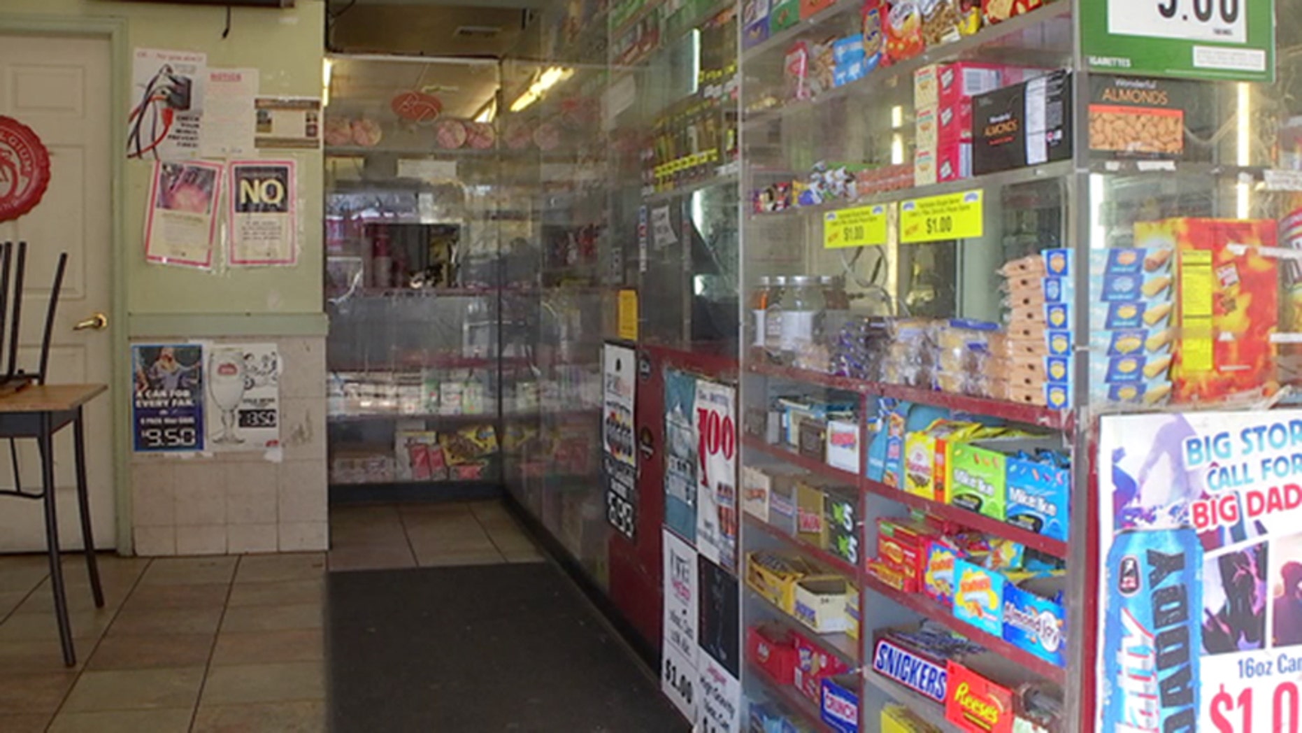 Bulletproof glass lines the counter of a deli in Philadelphia.