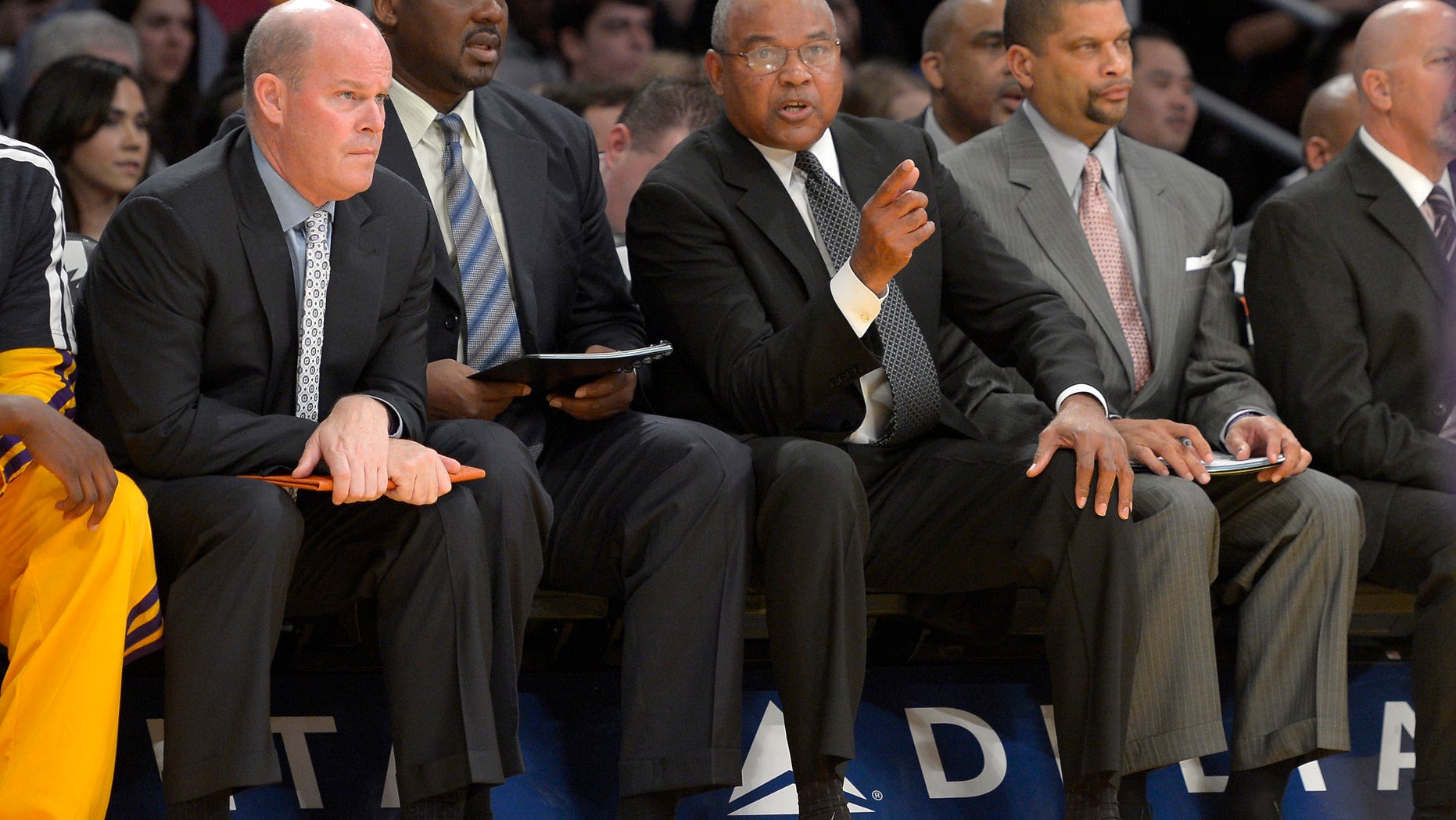 FILE - In this Nov. 9, 2012 file photo, Los Angeles Lakers interim head coach Bernie Bickerstaff, second from right, looks on along with assistant coaches Steve Clifford, left, Chuck Person, second from left, and Eddie Jordan, right, during the first half of their NBA basketball game against the Golden State Warriors in Los Angeles. Michael Jordan felt he needed a head coach with a little more NBA experience this time around to improve his struggling Charlotte Bobcats. The former NBA superstar and current owner believes he's found one in Steve Clifford. (AP Photo/Mark J. Terrill, File)