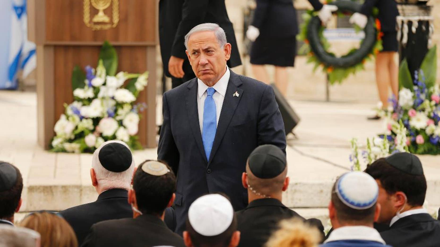 April 22, 2015: In this file photo, Israel's Prime Minister Benjamin Netanyahu leaves the podium after speaking during a Memorial Day ceremony to commemorate the country's fallen soldiers at Mount Herzl military cemetery in Jerusalem.