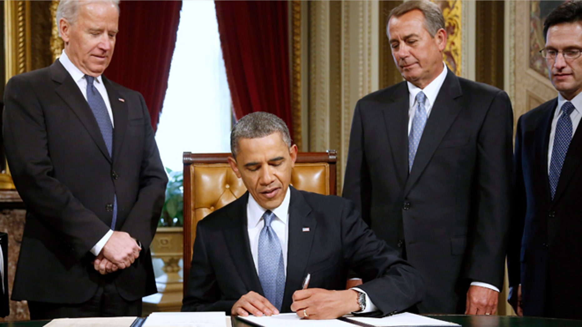 Jan. 21, 2013: President Barack Obama signs a proclamation to commemorate the inauguration, entitled a National Day of Hope and Resolve, on Capitol Hill in Washington.