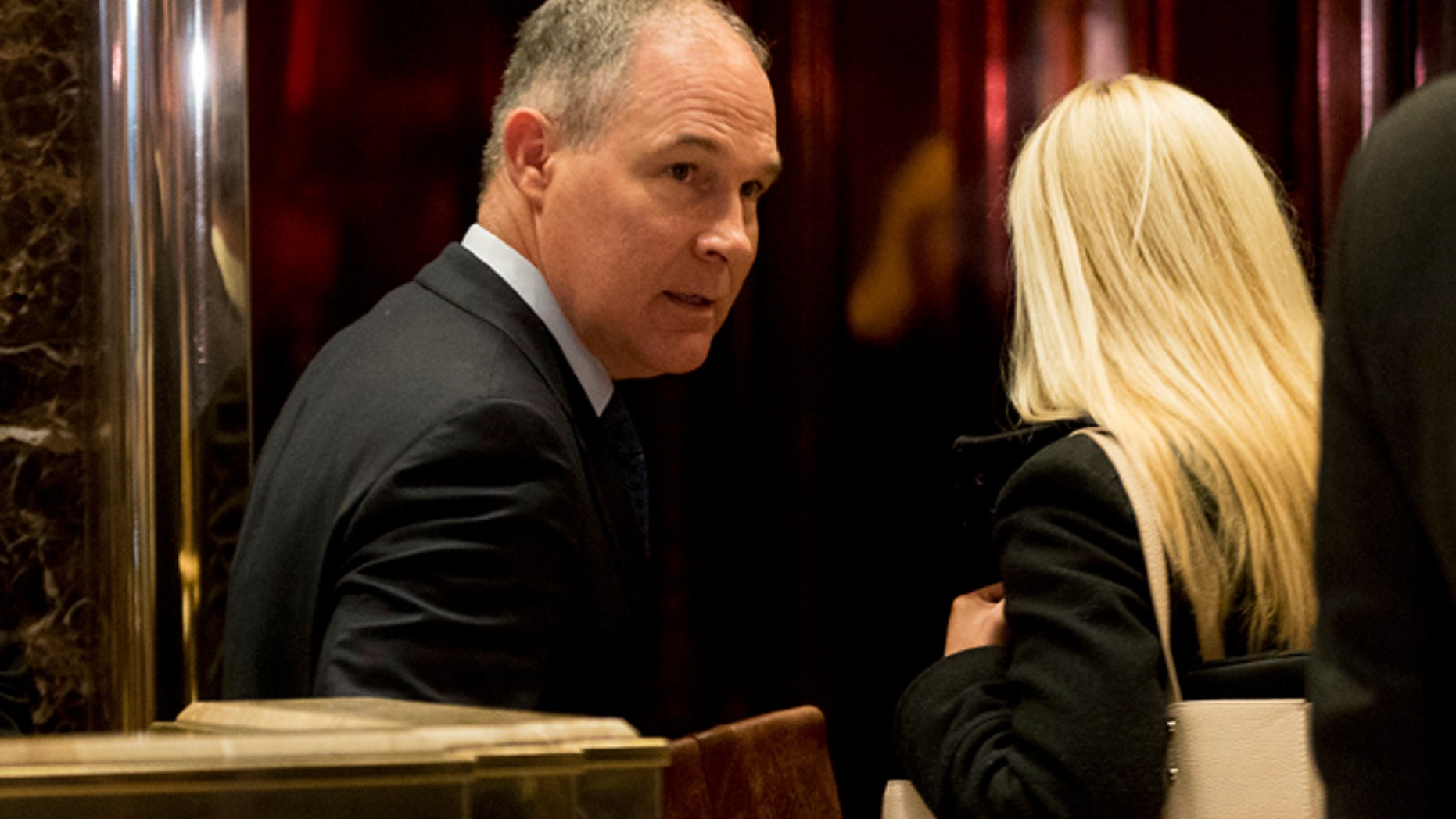 FILE -- Oklahoma Attorney General Scott Pruitt arrives at Trump Tower in New York, Wednesday, Dec. 7, 2016.