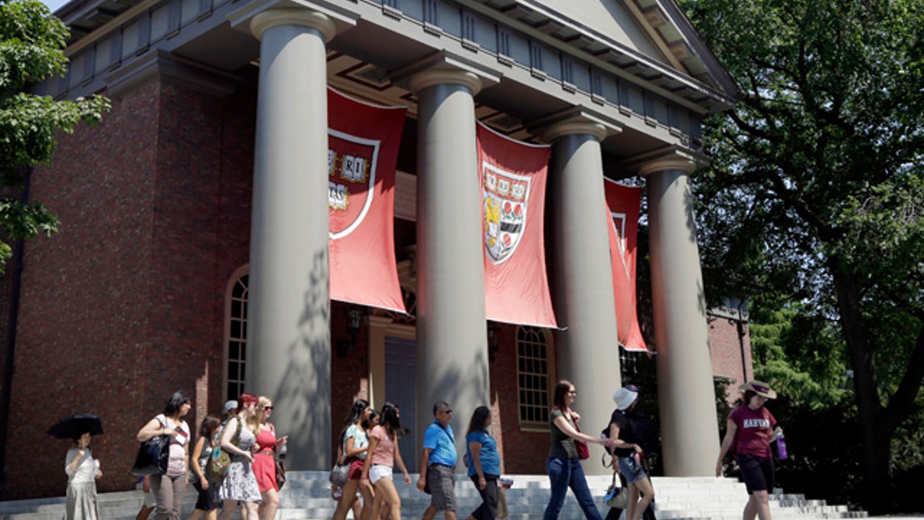 Aug. 30, 2012: People are led on a tour group at the campus of Harvard University in Cambridge, Mass. (AP)