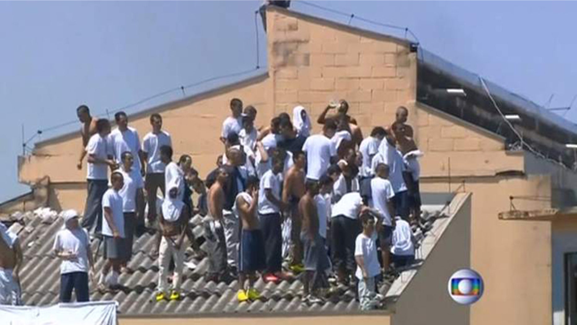Inmates at the Parana state prison in southern Brazil demand better food and improved living conditions during a riot.