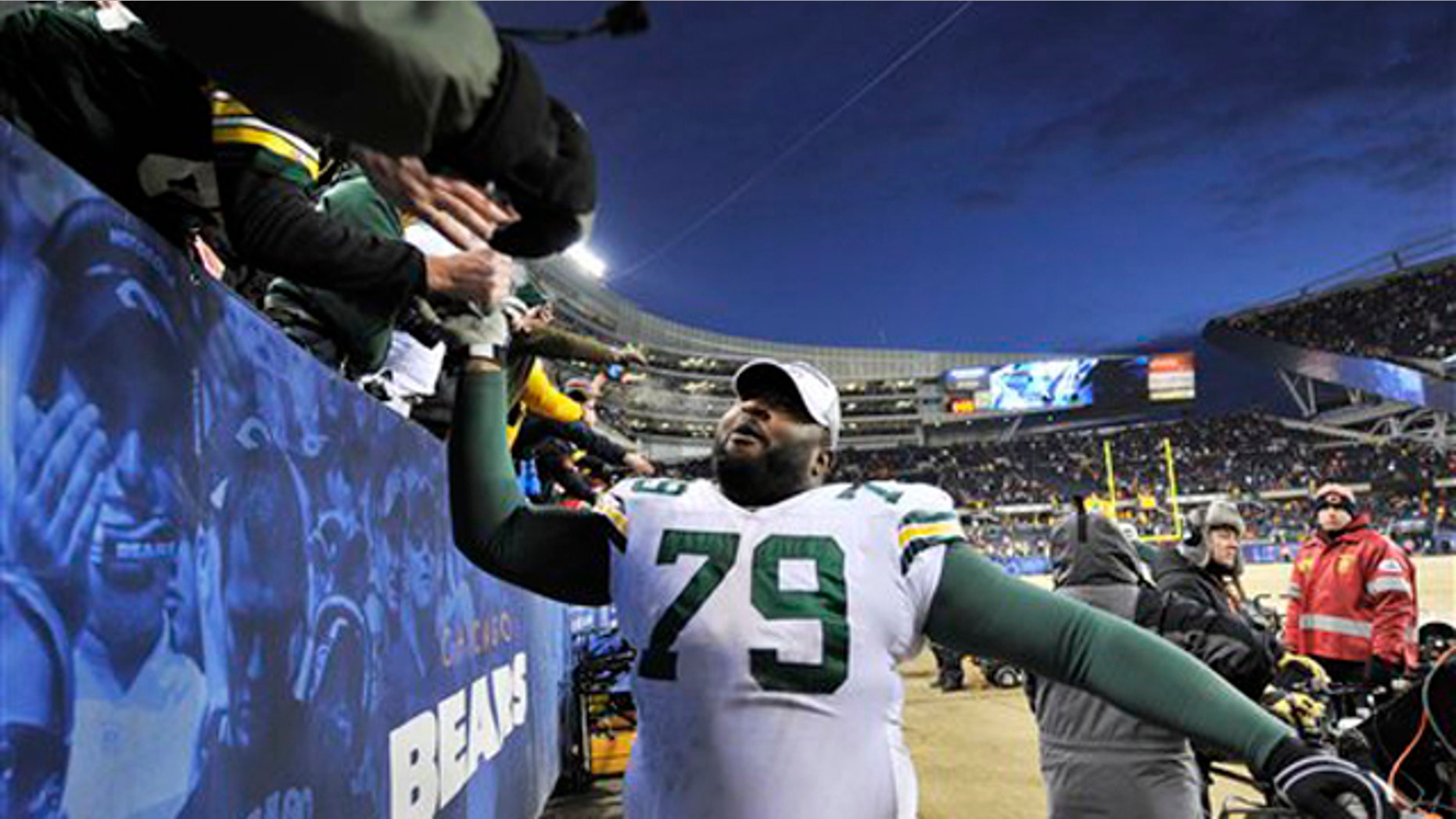 Jan. 23, 2011: Green Bay Packers defensive tackle Ryan Pickett celebrates with fans after the Packers' 21-14 win over the Chicago Bears in the NFC Championship NFL football game in Chicago.