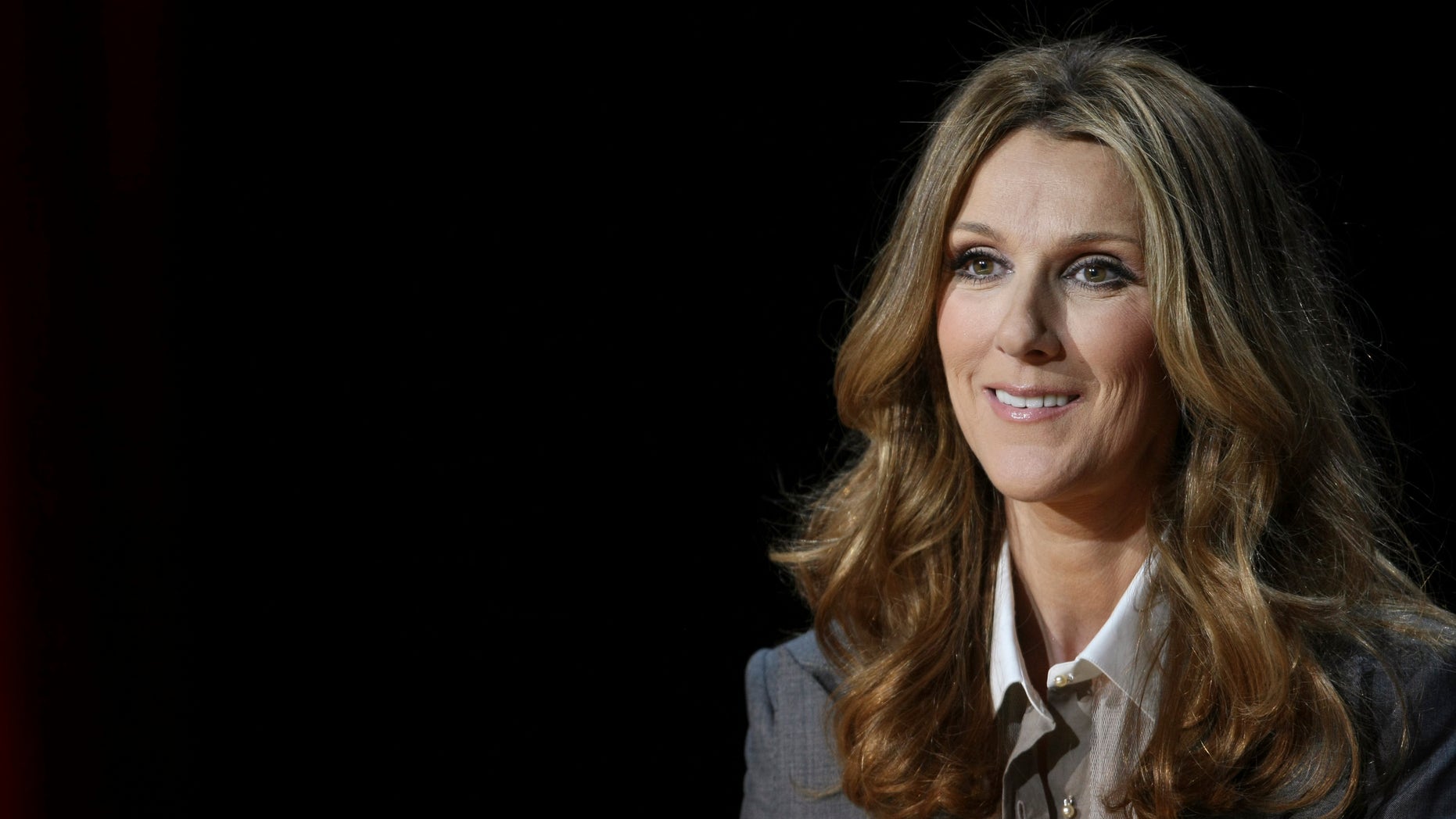 Singer Celine Dion listens to a question from a reporter following her opening night performance at the Colosseum at Caesars Palace in Las Vegas, Nevada March 15, 2011.