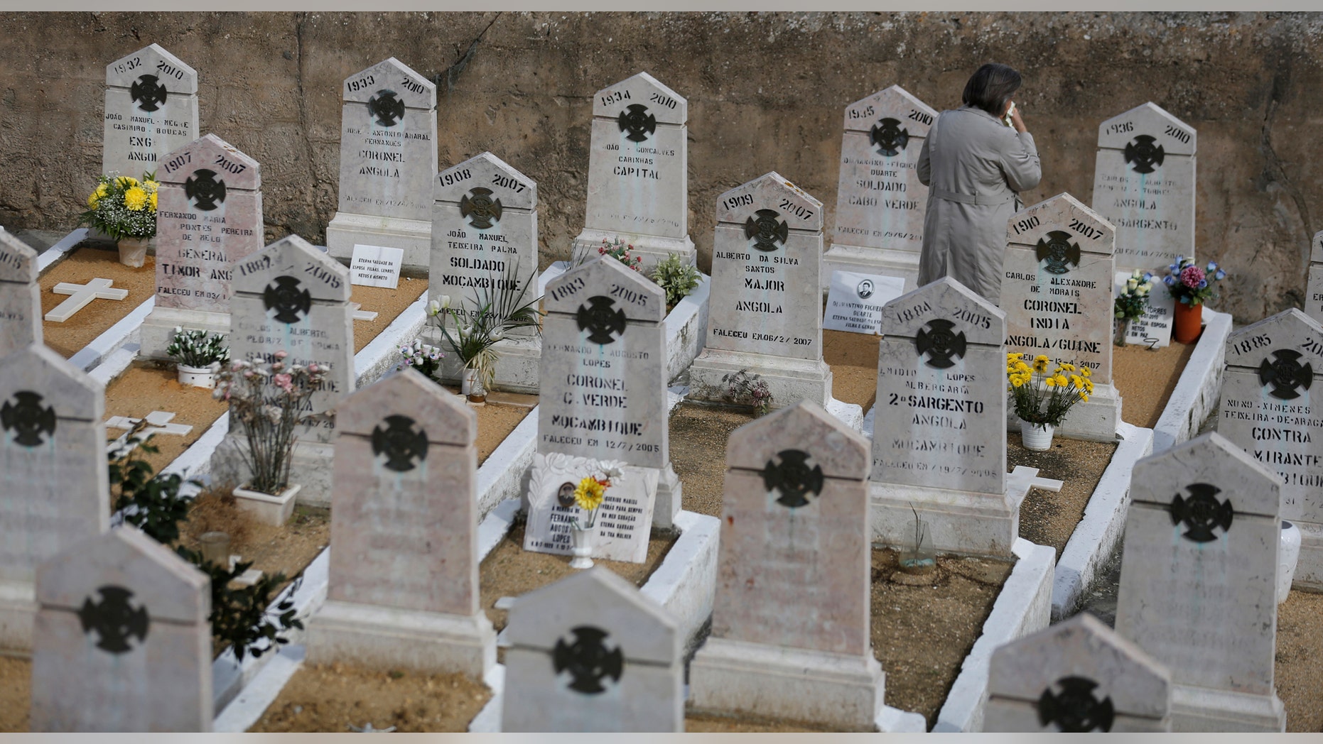 File photo: A woman visits a grave during All Saints Day at Alto de Sao Joao cemetery in Lisbon, Portugal, November 1, 2016. (REUTERS/Rafael Marchante)