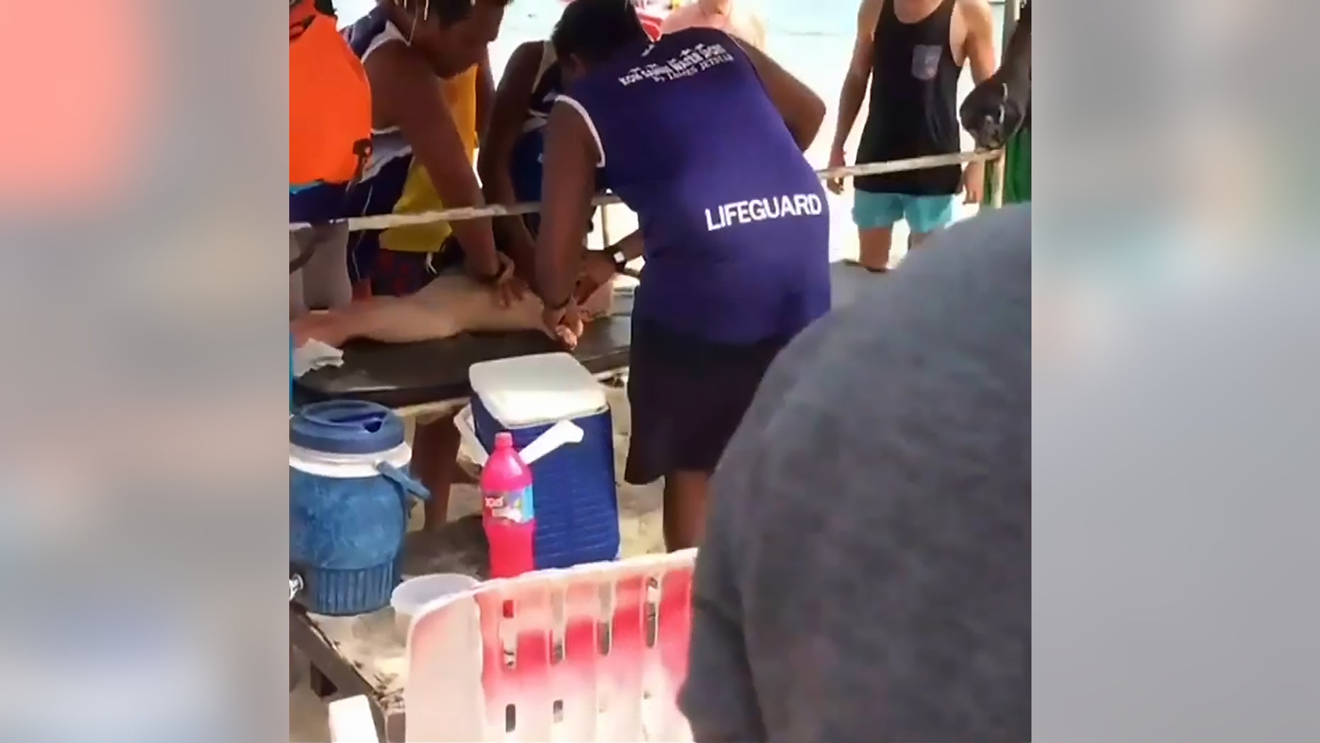 Pic shows: boy being attended by paramedics;
Dramatic mobile footage has caught the tense moment rescuers performed CPR on a two-year-old boy whose heart stopped after he was stung by a deadly box jellyfish.
The little Russian lad, not named, was on holiday on Koh Samui Island in southern Thailandâs Surat Thani Province with his mum, 29-year-old Yekaterina Ivanova.
He was swimming in shallow waters with her when the extremely venomous species of box jellyfish (Cubozoa) stung him and caused him to scream in agony.
It was not long before the boy lost consciousness as the venom started to take effect. His mum shouted for help and luckily beachgoers nearby rushed over to help them get out of the water.
Watcharin Kongmun, one of the locals at Lamai beach where they were swimming, helped them get out of the water and quickly administered CPR (cardiopulmonary resuscitation) to the little boy as Yekaterina frantically looked on.
And in an amazing escape from death, the two-year-old regained consciousness and was taken to the Bangkok-Samui hospital for treatment.
Yekaterina was said to have also suffered a painful sting from the box jellyfish but, because her body mass was bigger, she was not as quickly affected by the venom.
Both mother and son received treatment at hospital and are now said to be out of danger and currently recovering.
There have already been 11 cases of tourists being stung by box jellyfish in Thailand since 31st June this year.
The animal gets its name from its cube-like shape and is feared by swimmers and fisherman around the world because of its deadly venom.
The Cubozoa species is largely restricted to the tropical Indo-Pacific region, but some species can be found in the Atlantic Ocean, in the east Pacific Ocean, in the Mediterranean Sea, on the Japanese coast and even as far south as South Africa.
User âcumgranosalumâ said: "Jellies are around all year here and their sting is frequently deadly - they are one of the most deadly sti