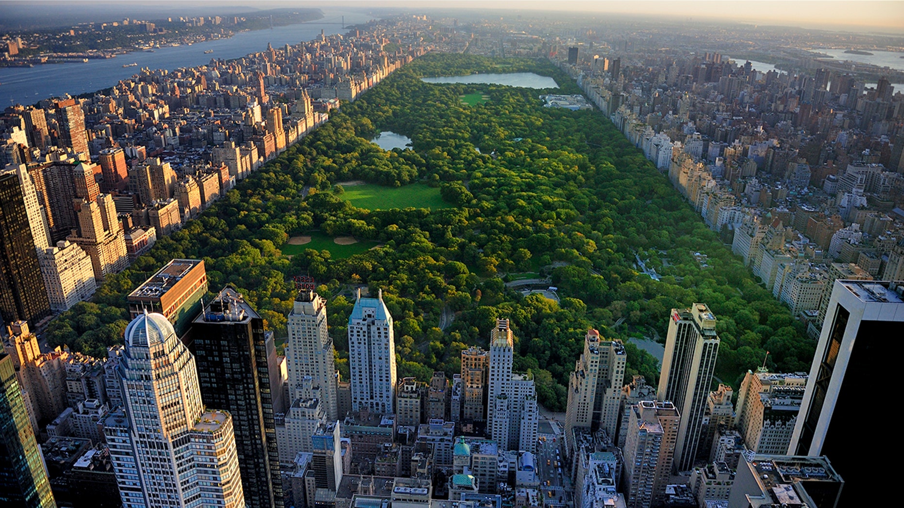 Central Park aerial view, Manhattan, New York; Park is surrounded by skyscraper