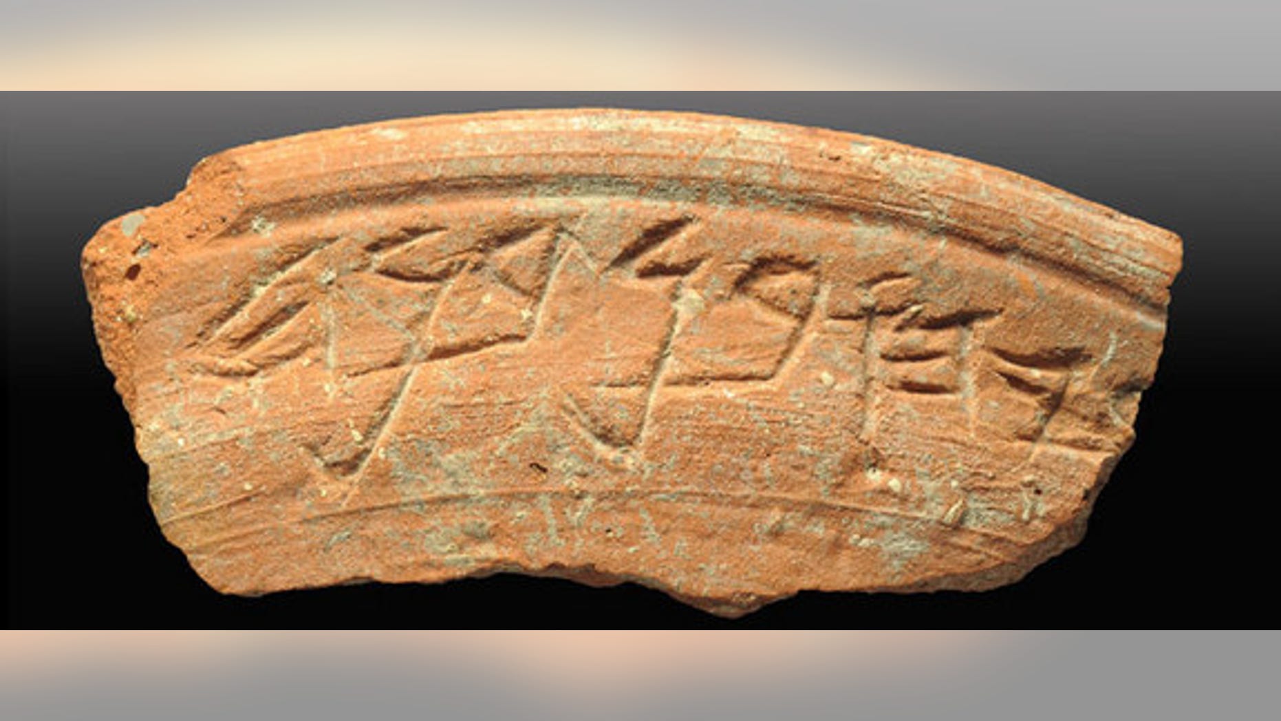 A ceramic bowl shard with a 2,700-year-old inscription. The bowl was found during an archaeological excavation in the City of David, an ancient neighborhood in Jerusalem.