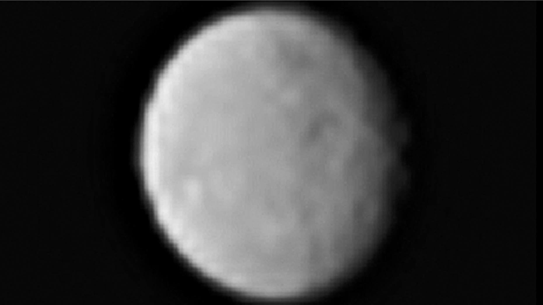 This processed image, taken Jan. 13, 2015, shows the dwarf planet Ceres as seen from the Dawn spacecraft. The image hints at craters on the surface of Ceres. Dawn's framing camera took this image at 238,000 miles from Ceres.