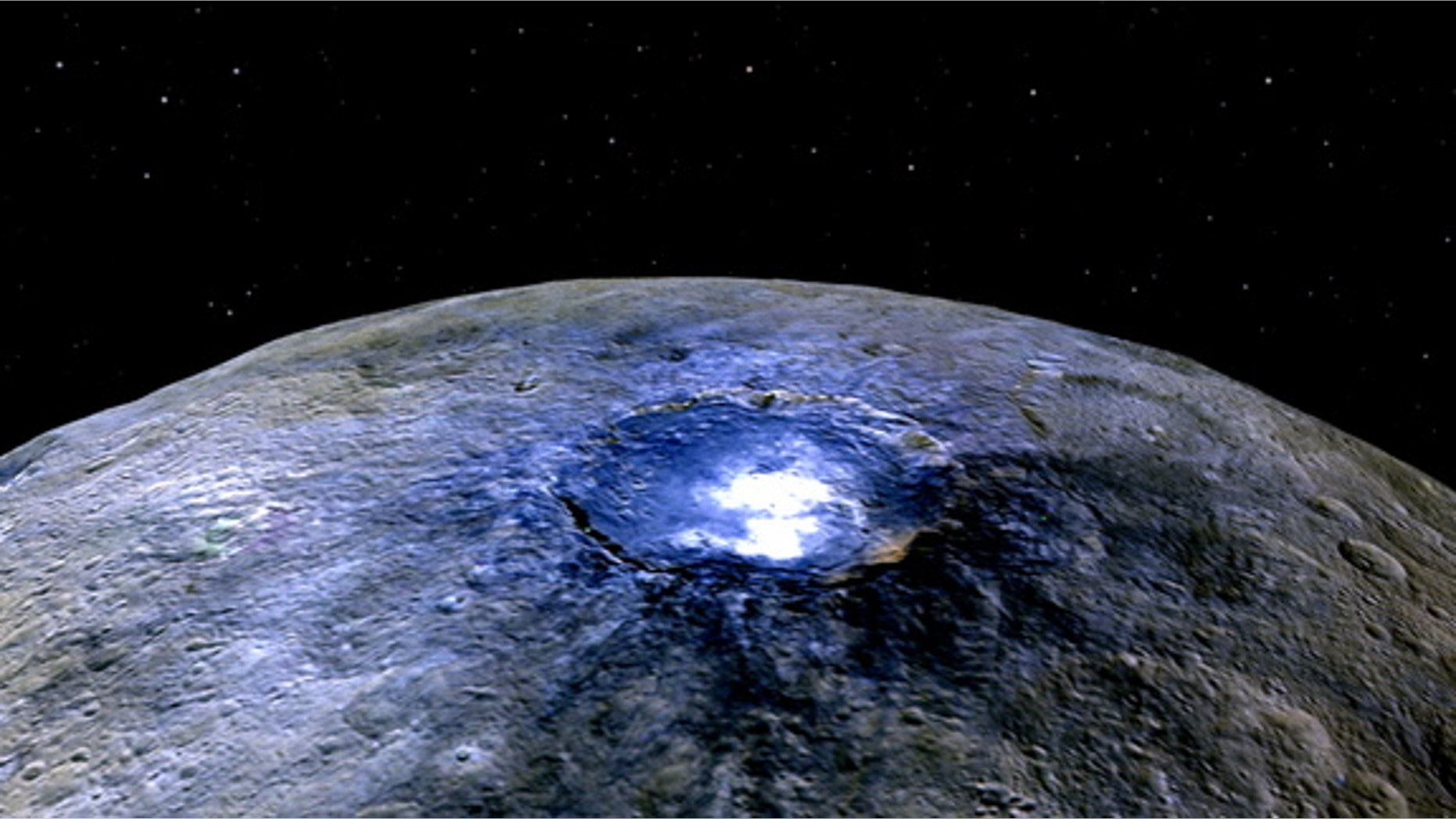 False-color view of Occator Crater showing differences in surface composition. Red corresponds to a wavelength range around 0.97 micrometers (near infrared), green to a wavelength range around 0.75 micrometers (red, visible light) and blue to a