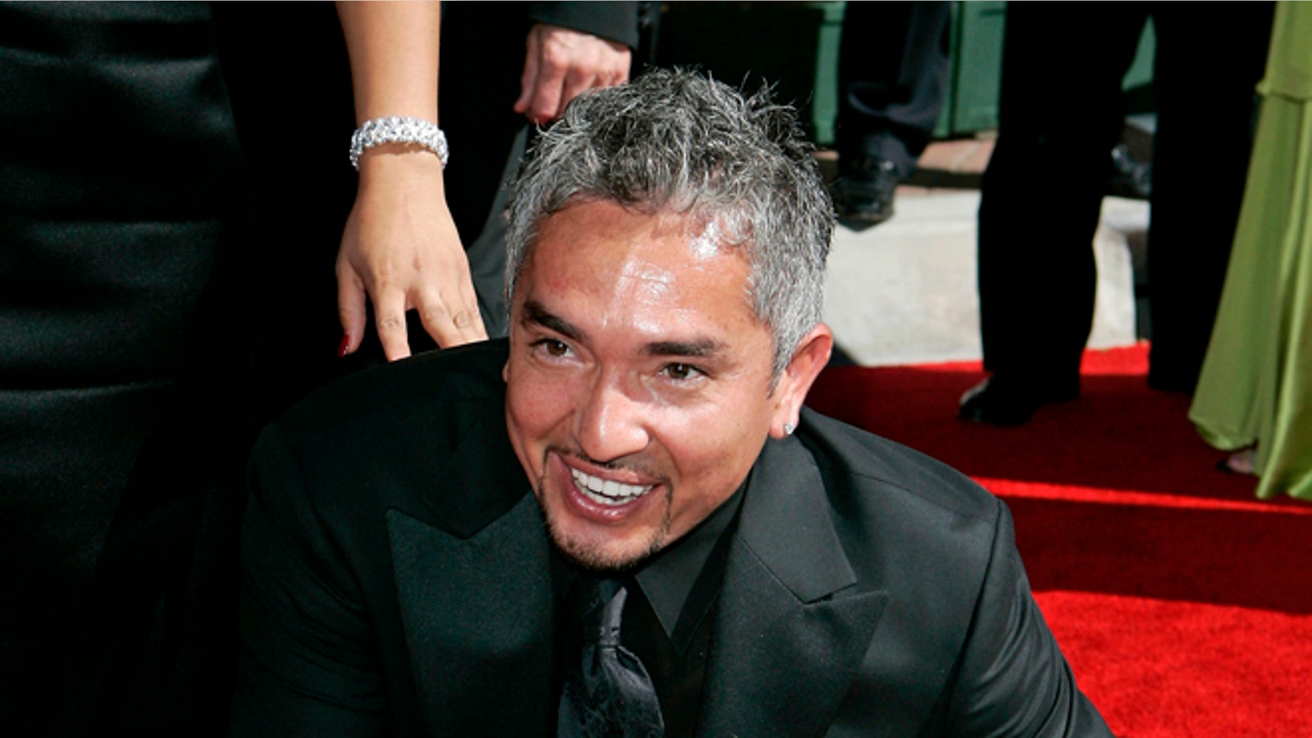 Aug. 19, 2006. Television personality and dog psychologist Cesar Milan arrives for the Creative Arts Emmy Awards in Los Angeles.