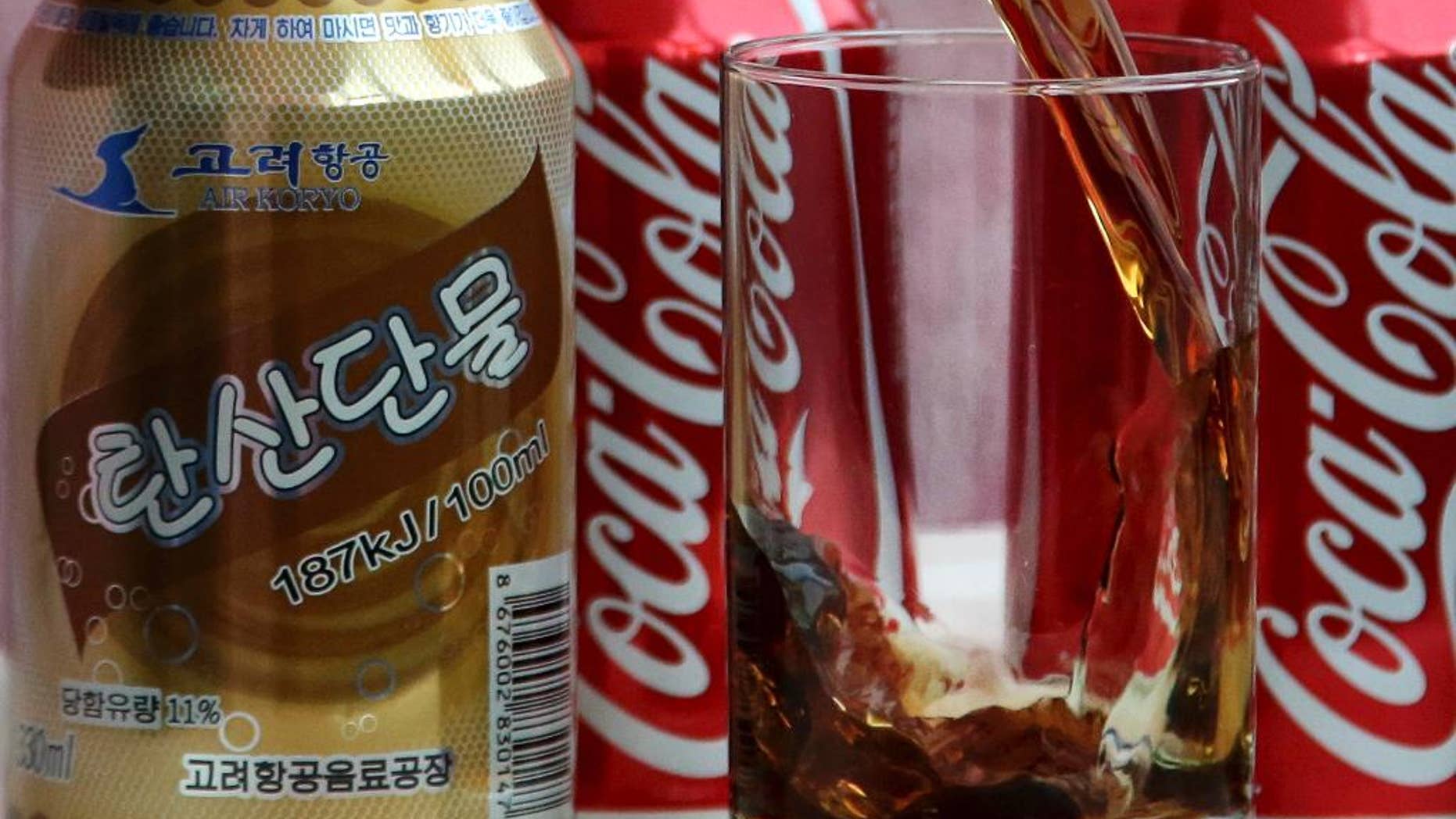 In this Tuesday, April 11, 2017, photo, a can of Air Koryo cola, produced by Air Koryo, the country's flagship airline which recently introduced its own brand of cola on flights to and from Beijing is seen in Pyongyang, North Korea. Coca Cola is possibly the world's most recognizable brand, an almost inescapable symbol of the global appeal of American-style consumer culture. There are only two countries in the world where Coke doesn't officially operate, and one of them is North Korea. (AP Photo/Wong Maye-E)