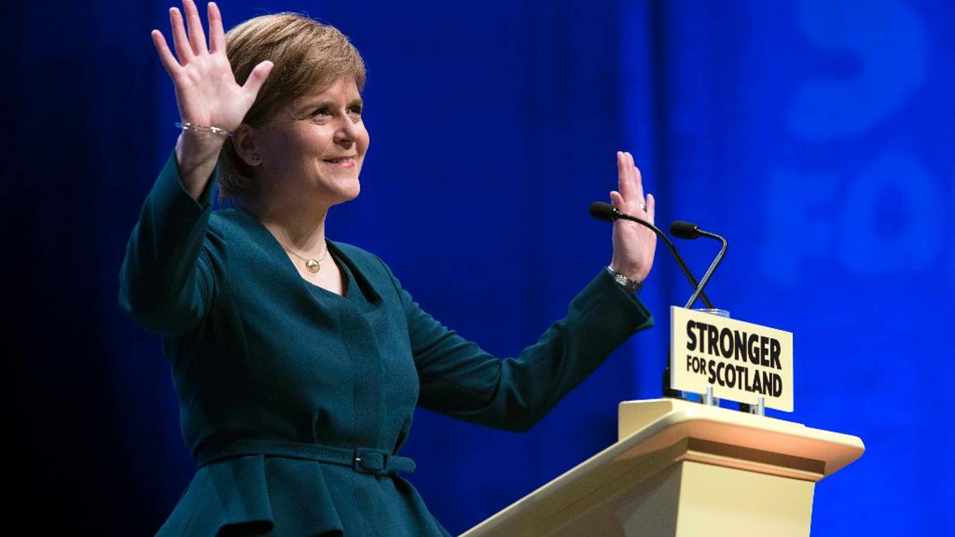First Minister of Scotland and the leader of the Scottish National Party Nicola Sturgeon, at the start of the SNP's biggest-ever conference, in Glasgow, Scotland, Thursday, Oct. 13, 2016. Scotland's leader says she will publish a bill next week laying the groundwork for a new independence referendum — the first step toward a new vote on whether Scotland should leave the United Kingdom. (John Linton/PA via AP)