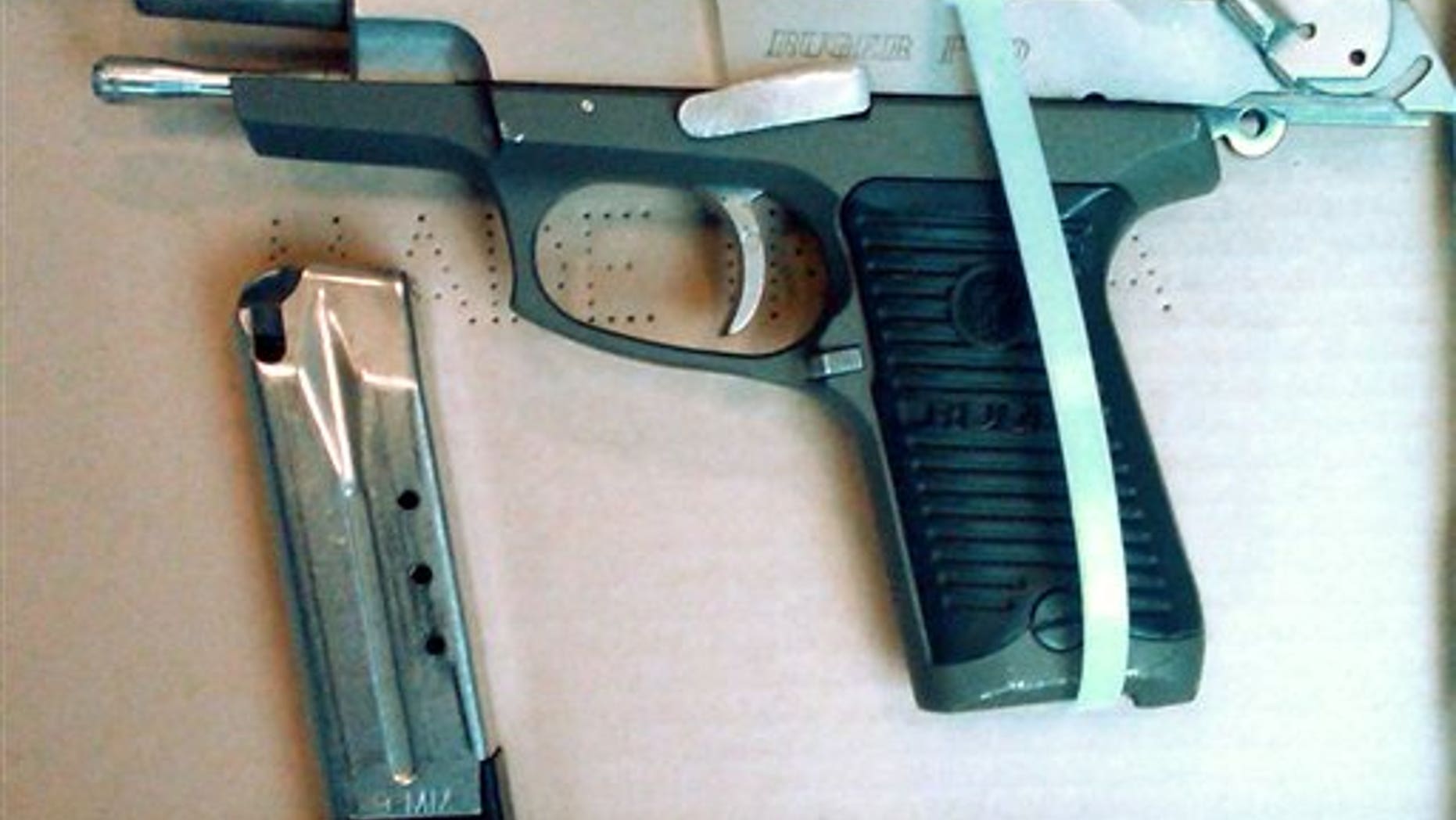 This photo provided by the New York City Police Dept. shows a semi-automatic pistol recovered by police after Officer Peter Figoski was shot in the face and killed early Monday morning, Dec. 12, 2011, while responding to a report of a break-in at a Brooklyn apartment.