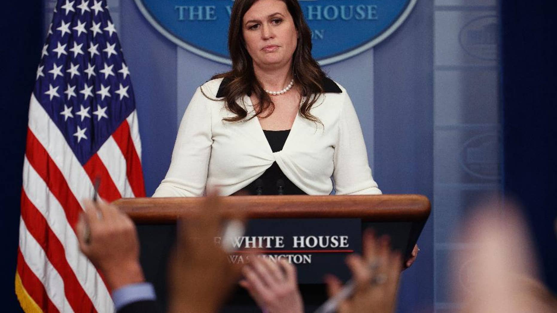 White House deputy press secretary Sarah Huckabee Sanders addresses reporters. Audio and video recordings have been prohibited at daily briefings since June 29.