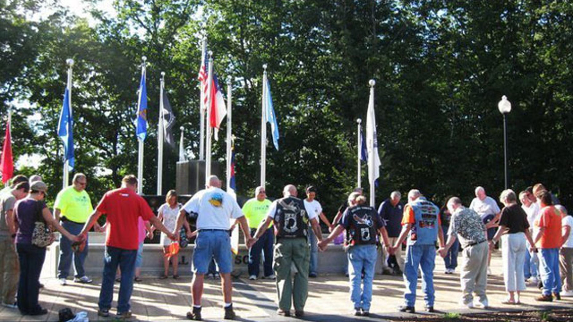 Residents CoResidents of a North Carolina town are flying the Christian flag from private buildings and homes in a sign of protest following a decision by town leaders to remove the flag from a town memorial after being threatened by an ACLU lawsuit.