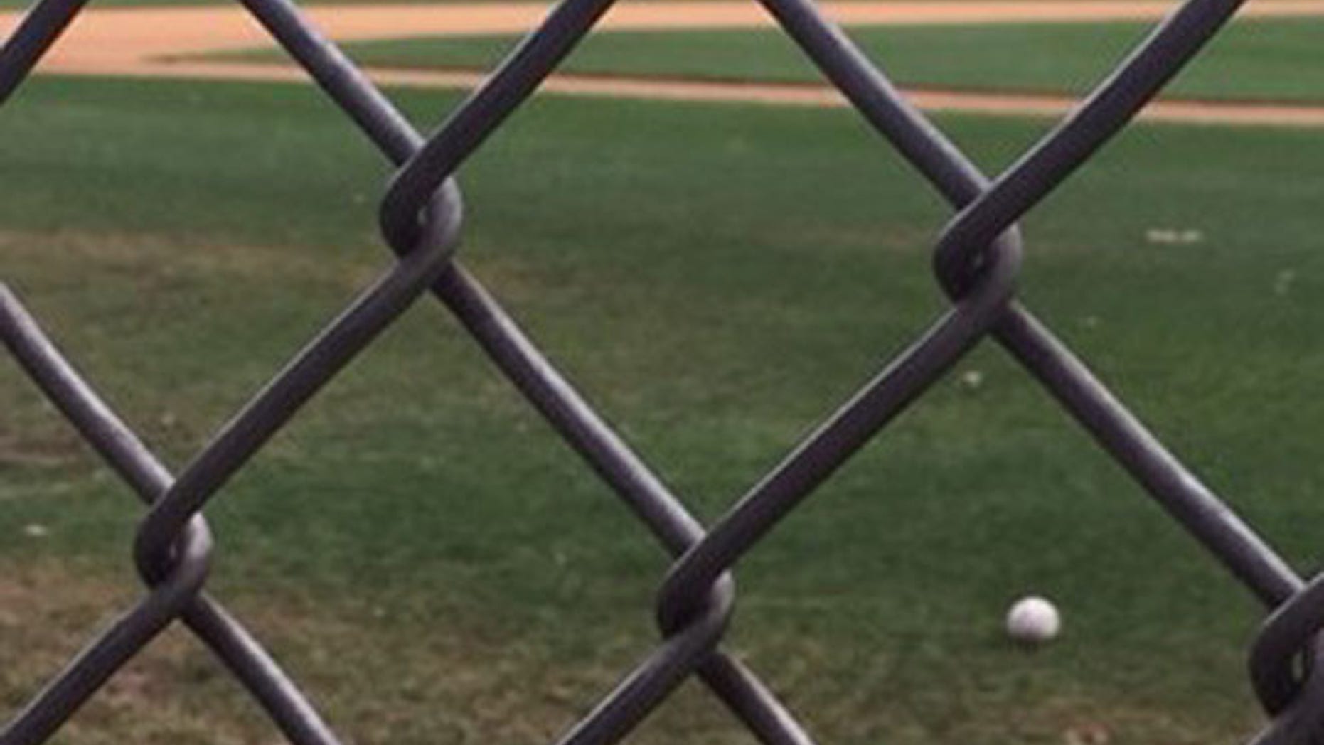 A baseball rests on the Alexandria, Va., field where a congressional baseball practice was attacked.