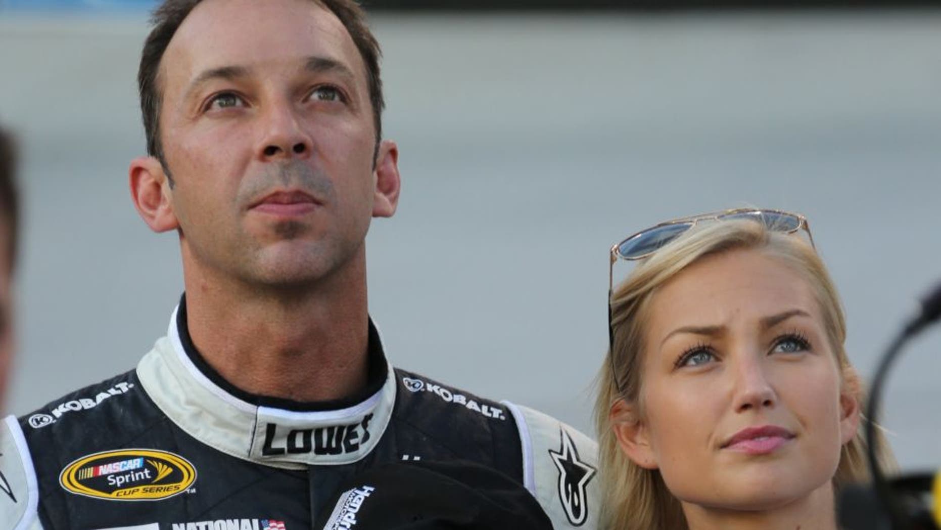 USA -Aug 23: NASCAR Sprint Cup Series crew chief Chad Knaus and his girlfriend Brooke Werner stand on pit road during the National Anthem prior to the start of the NASCAR Sprint Cup Series Irwin Tools Night Race at the Bristol Motor Speedway in Bristol, TN. Picture taken on Aug 23, 2014 in the United States. (Photo by Jim Fluharty/NASCAR Illustrated/Sporting News via Getty Images)