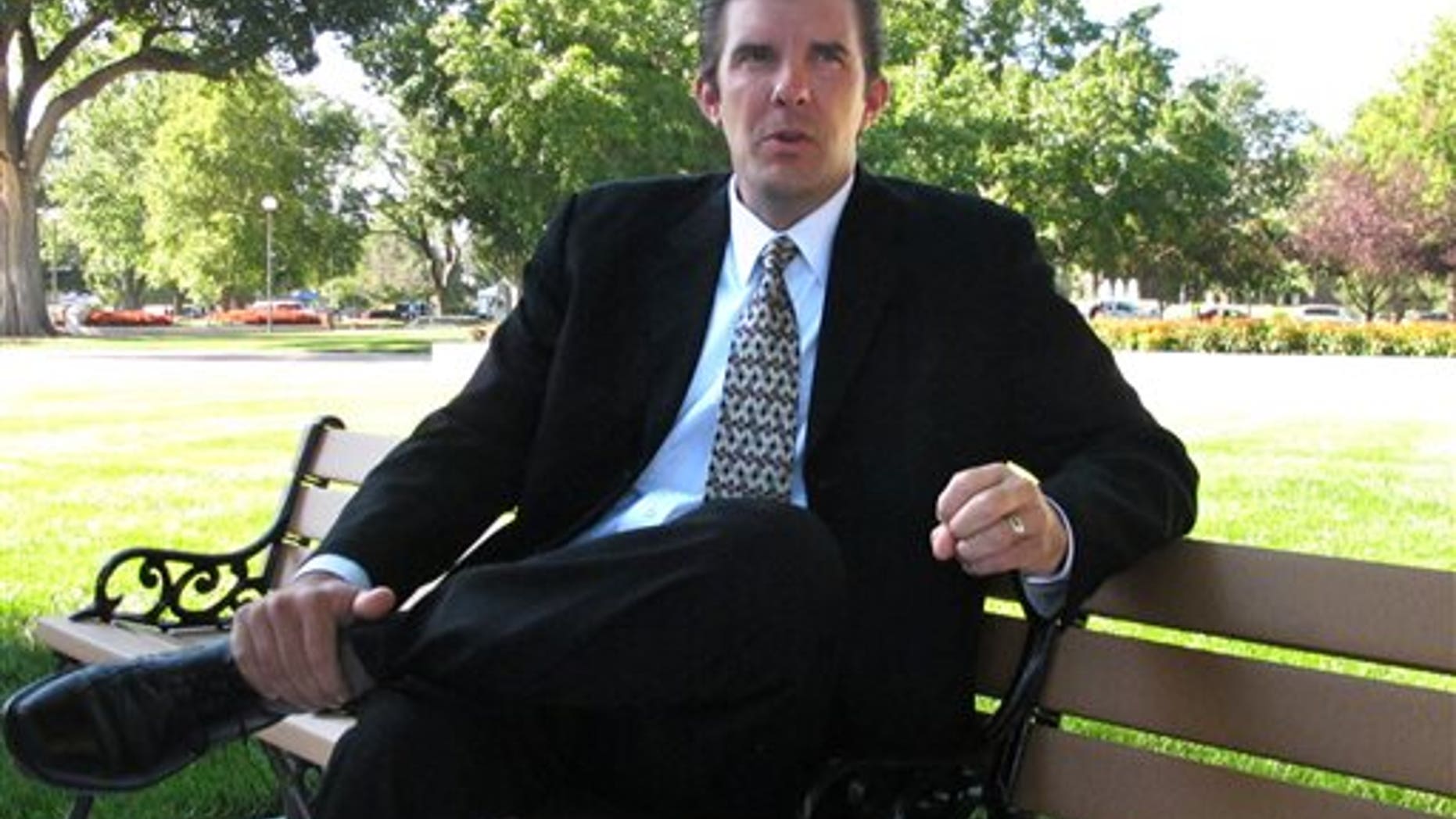 Aug. 13, 2014: Chad Taylor discusses his campaign during an interview on the Statehouse grounds in Topeka, Kan.
