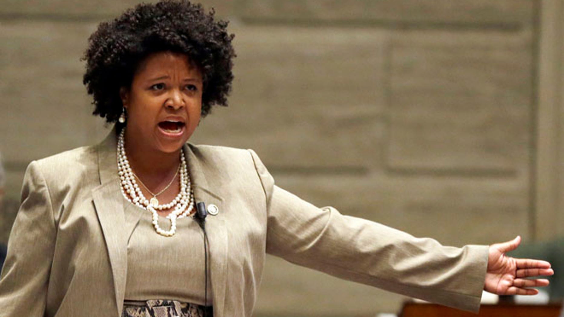 FILE - In this Sept. 10, 2014, file photo, Missouri state Sen. Maria Chappelle-Nadal speaks on the Senate floor in Jefferson City, Mo. Chappelle-Nadal says she posted and then deleted a comment on Facebook that said she hoped for President Donald Trump's assassination. The Democratic Senator says she didn't mean what she posted Thursday, Aug. 17, 2017, but was frustrated with the president's reaction to the violence last weekend in Charlottesville, Va.(AP Photo/Jeff Roberson, File)