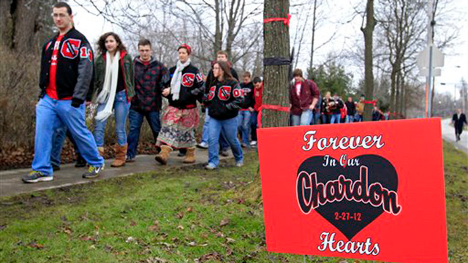 March 1, 2012: Students and parents march to Chardon High School in Chardon, Ohio, to honor the three students who were killed in a shooting there Monday.