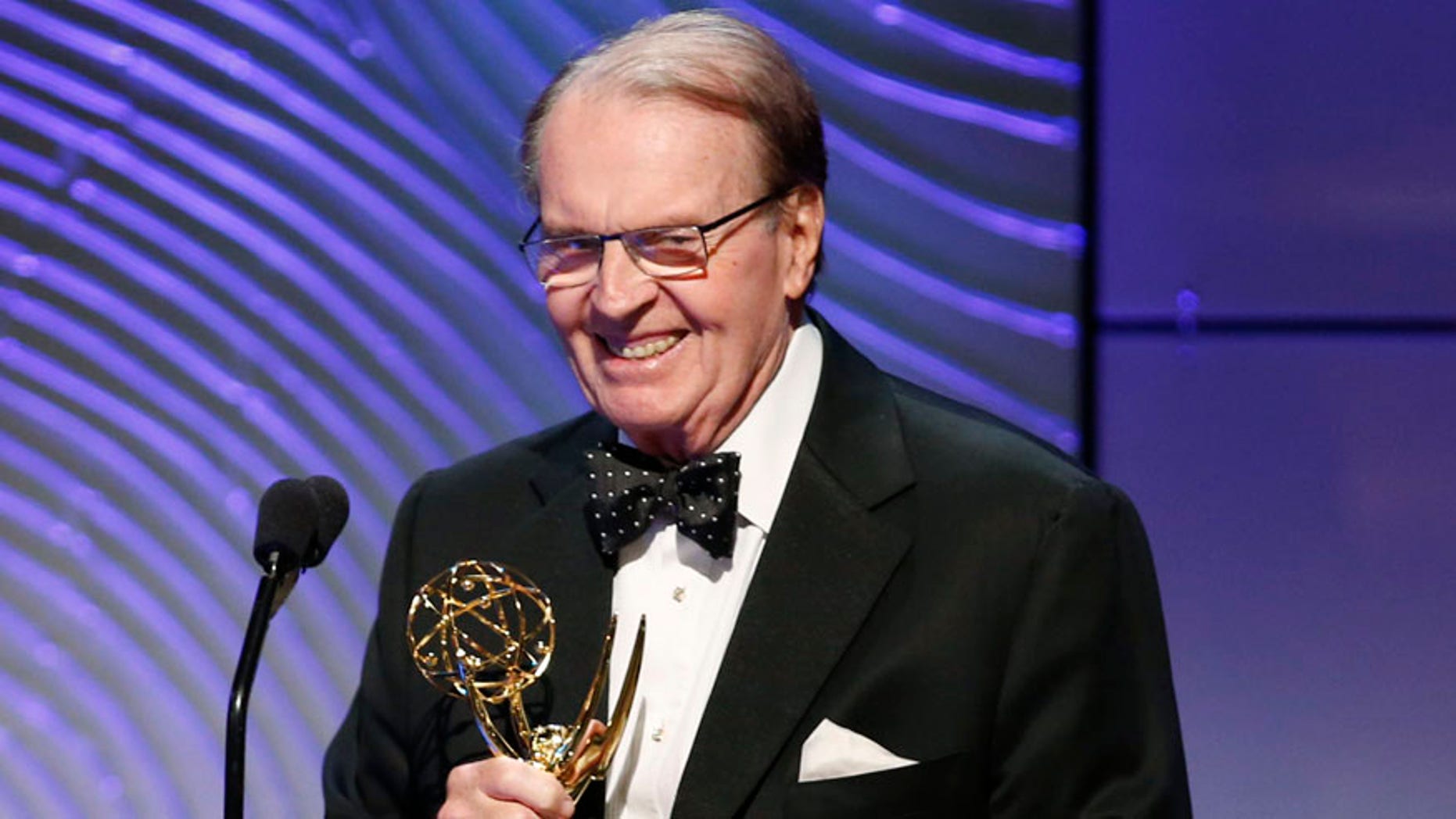 Executive producer Rand Morrison (L) and anchor Charles Osgood of "CBS Sunday Morning" accept the outstanding morning program award during the 40th annual Daytime Emmy Awards in Beverly Hills, California June 16, 2013. REUTERS/Danny Moloshok (UNITED STATES - Tags: ENTERTAINMENT) - RTX10QIY