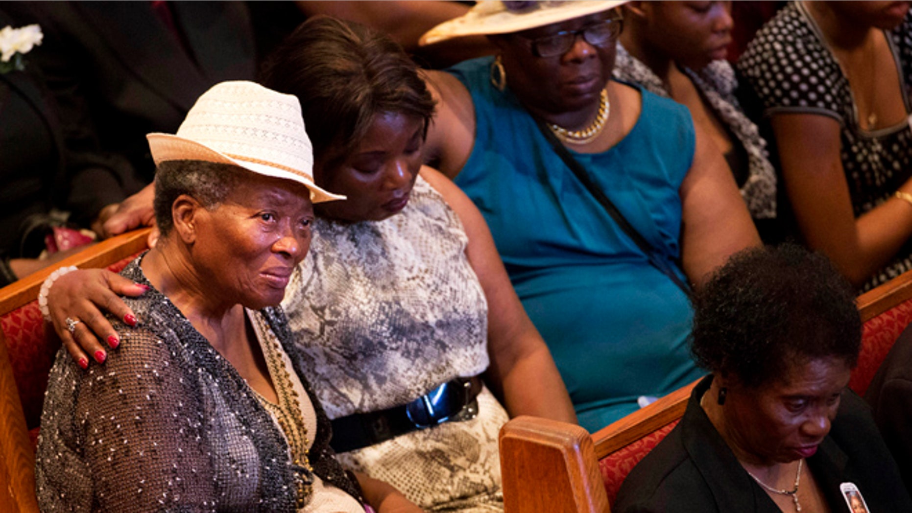 June 25, 2015: Mourners gather before the funeral service for Ethel Lance, one of the nine people killed in the shooting at Emanuel AME Church last week in Charleston, in North Charleston, S.C.