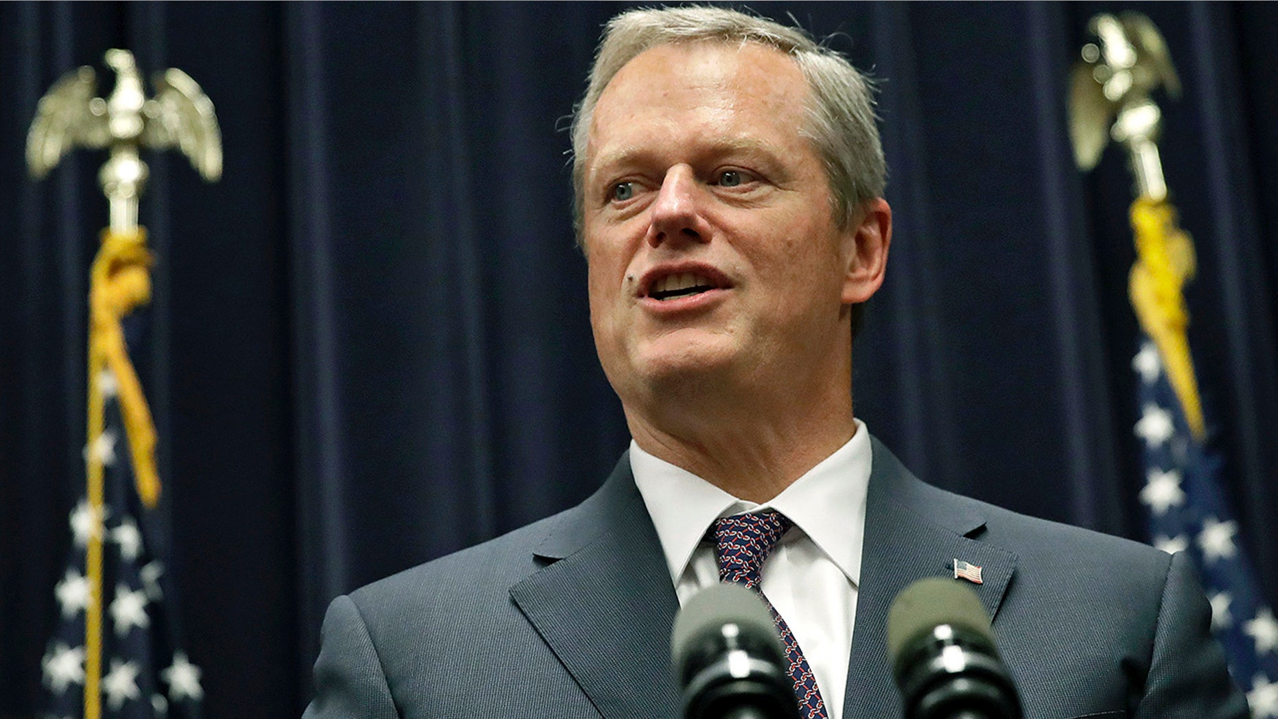 Massachusetts Gov. Charlie Baker addresses a gathering at the Statehouse in Boston, July 27, 2017.