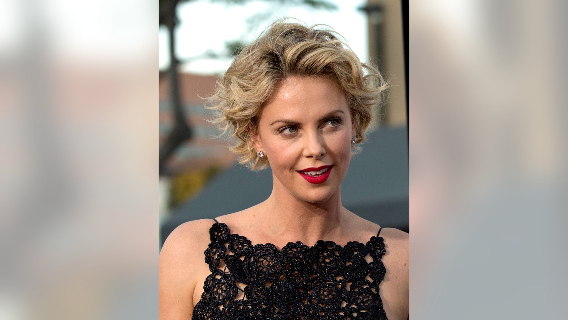 May 15, 2014. Charlize Theron poses at the premiere of "A Million Ways to Die in the West" in Los Angeles, California.