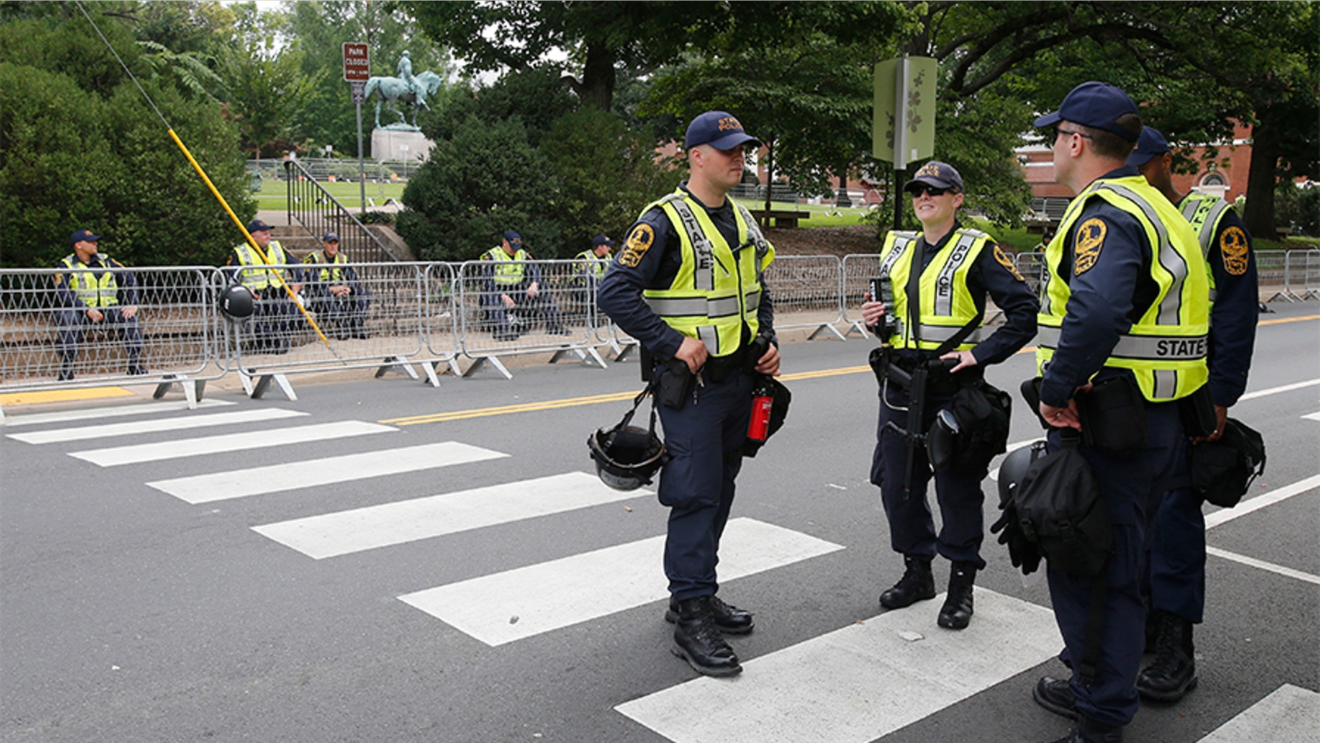 State Police on Saturday patrol the road in front of Market Street park as they lock down the downtown area in anticipation of the anniversary of last year's Unite the Right rally in Charlottesville, Va.