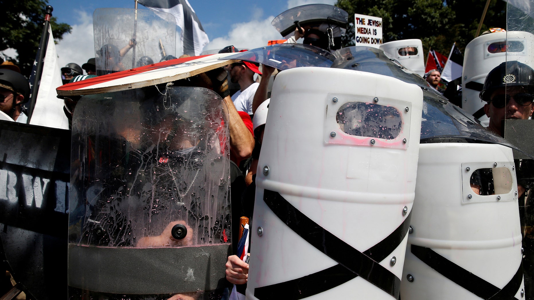 File photo - White nationalists shelter behind shields, displaying the Southern Nationalist flag, after clashing with counter protesters at a rally in Charlottesville, Virginia, U.S., Aug. 12, 2017. (REUTERS/Joshua Roberts)