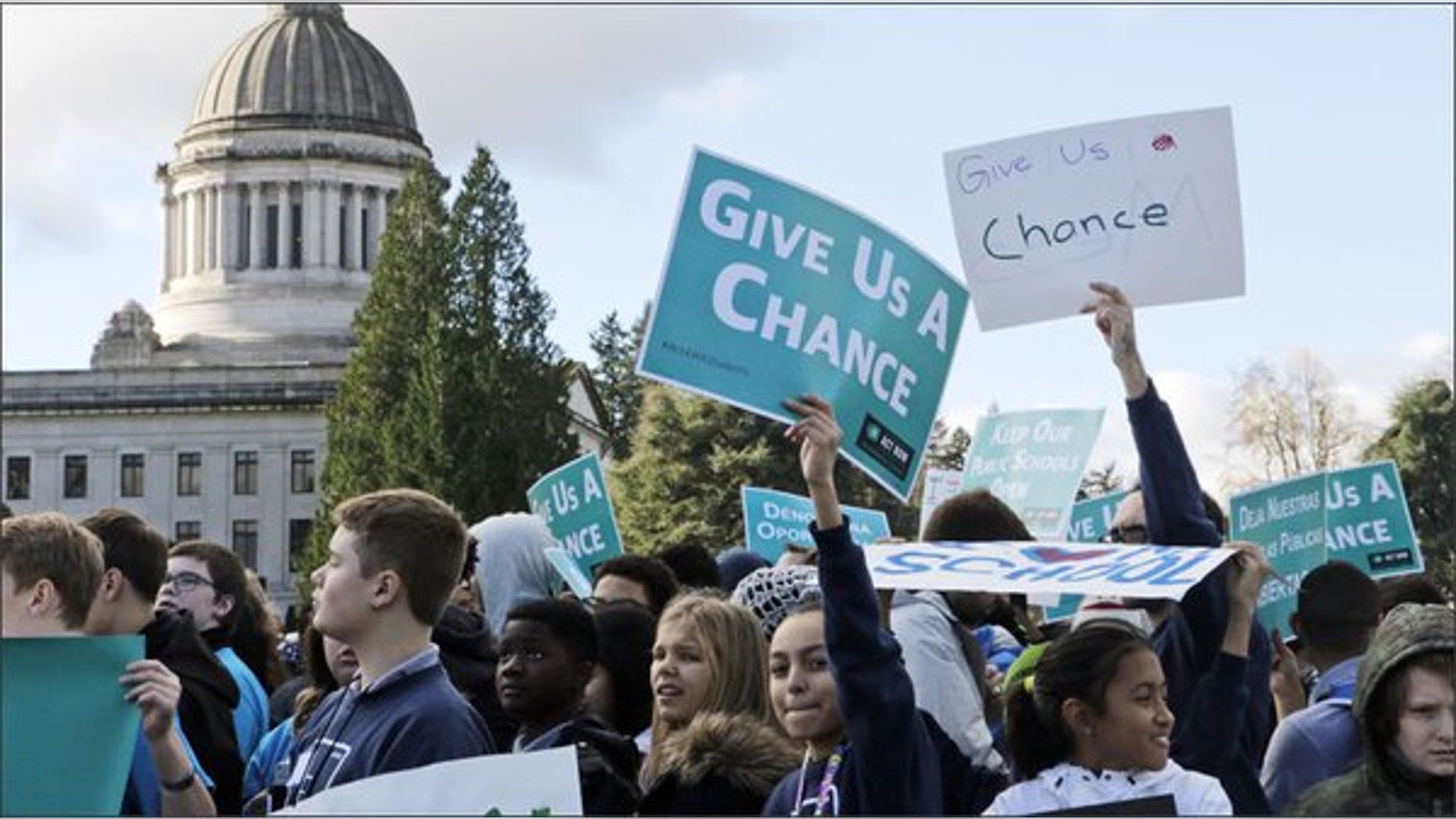 Students and other advocates of charter schools rally in Olympia, Wash., in November.