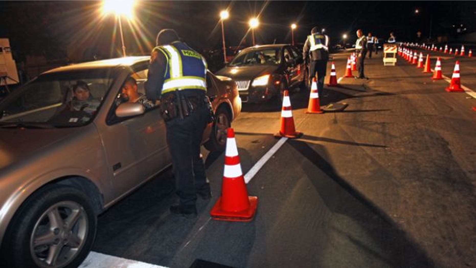 Dec. 16, 2011: Police officers check drivers at a sobriety checkpoint in Escondido, Calif.