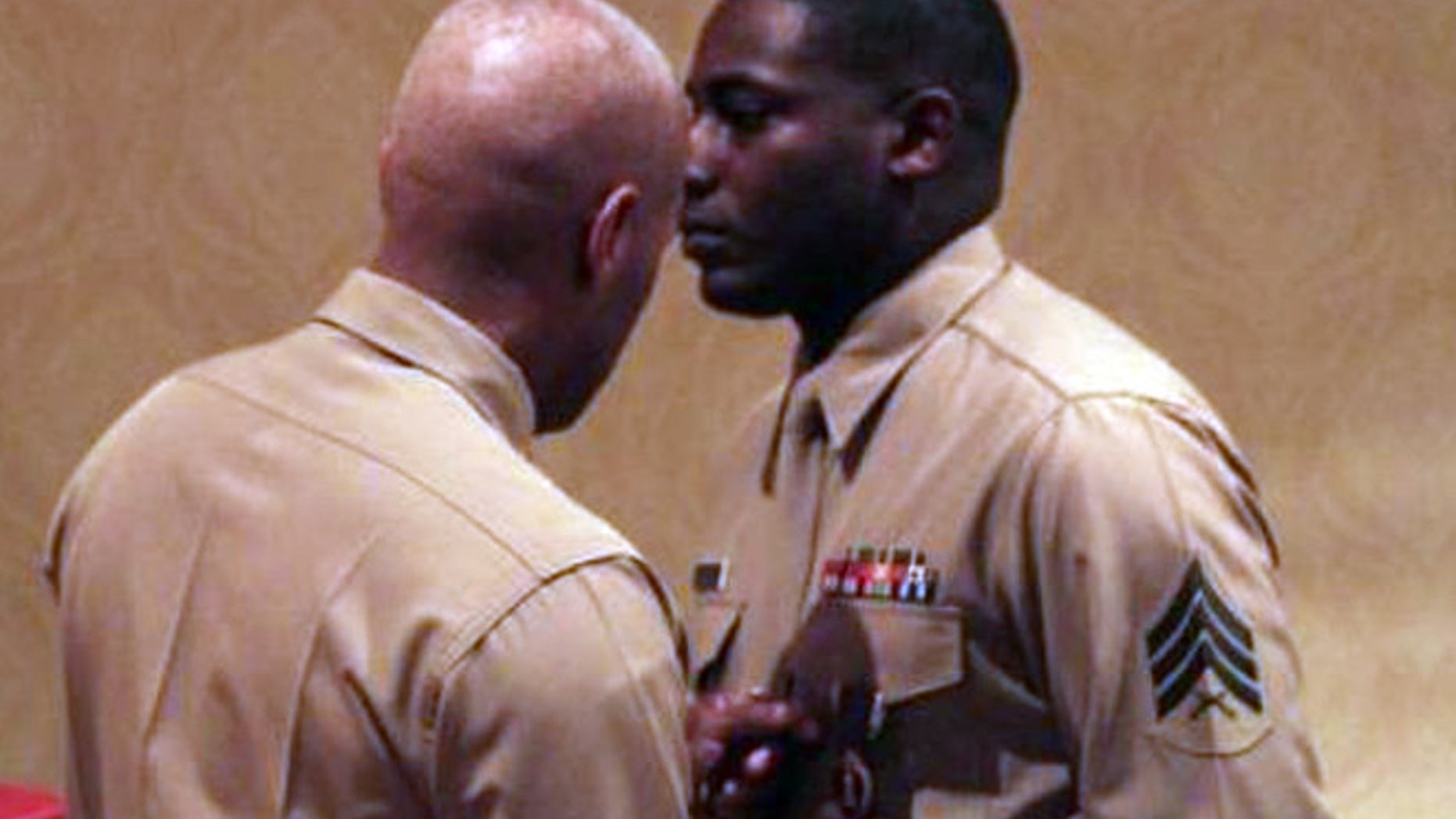 Sgt. DeMonte Cheeley is awarded the Purple Heart after being wounded at his recruitment center during a July 16 shooting spree.