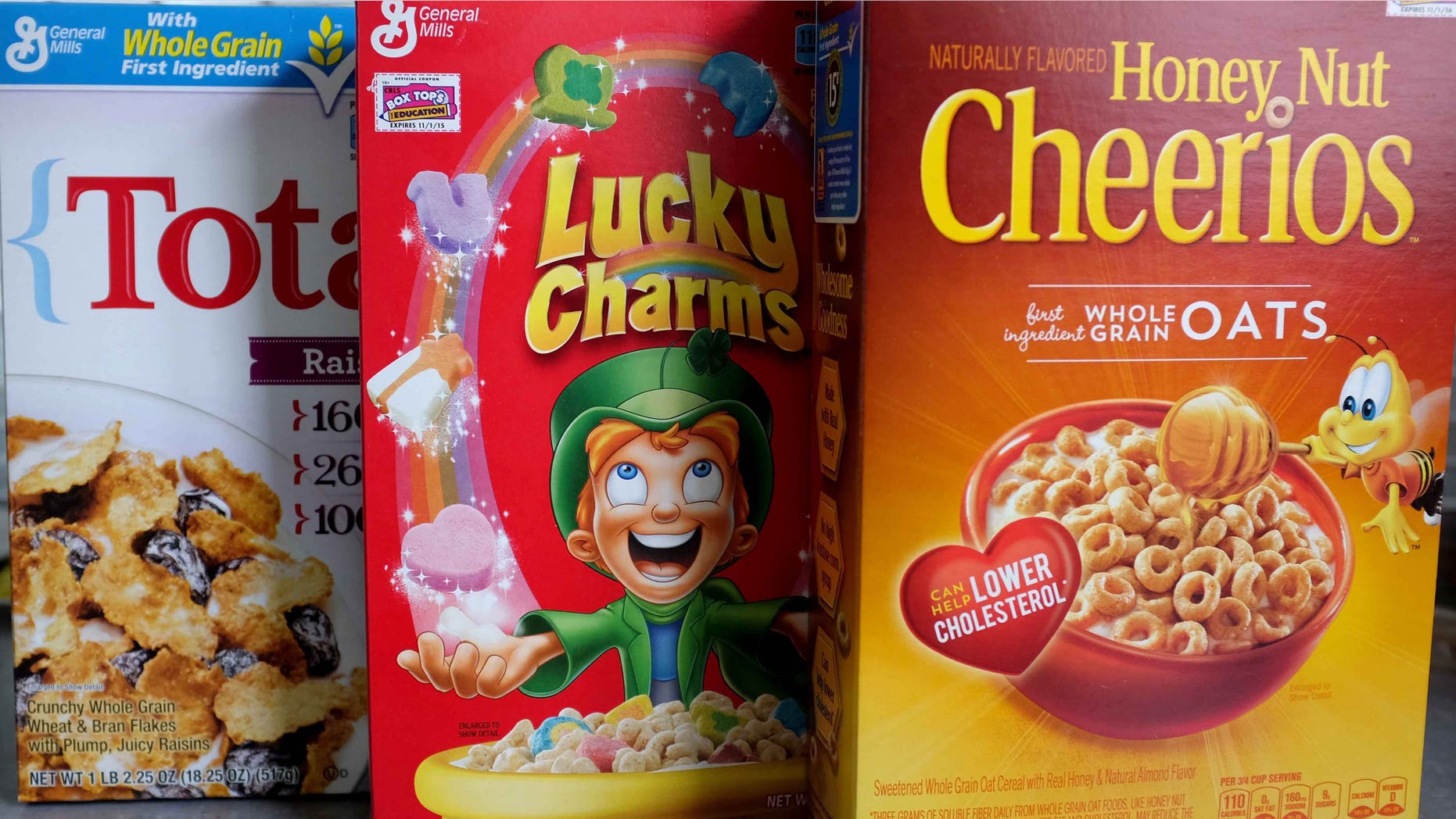 MIAMI, FL - SEPTEMBER 23: In this photo illustration, General Mills cereal products are seen on September 23, 2014 in Miami, Florida. During a share holders meeting tomorrow, General Mills investors are being given the opportunity to vote on whether the company should remove genetically modified organisms from its products. (Photo Illustration by Joe Raedle/Getty Images)