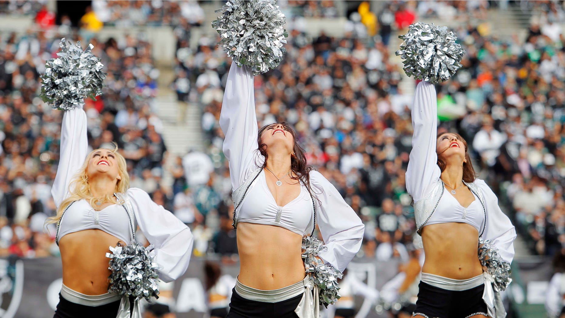 OAKLAND, CA - NOVEMBER 03: Raiderettes dance during a game between the Oakland Raiders and the Philadelphia Eagles on November 3, 2013 at O.co Coliseum in Oakland, California. The Eagles won 49-20. (Photo by Brian Bahr/Getty Images)