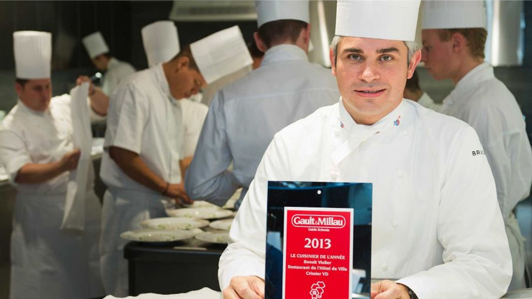 FILE: Chef Benoit Violier poses with the certificate as Chef of the year in his kitchen in the Hotel de Ville in Crissier, Switzerland.