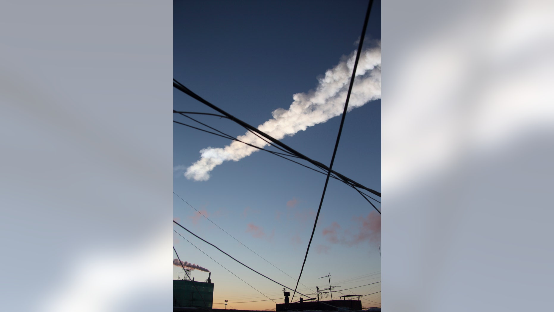 File photo - The trail of a falling object is seen above the Urals city of Chelyabinsk, in this view from a residential apartment February 15, 2013. (REUTERS/Igor Lyapustin)