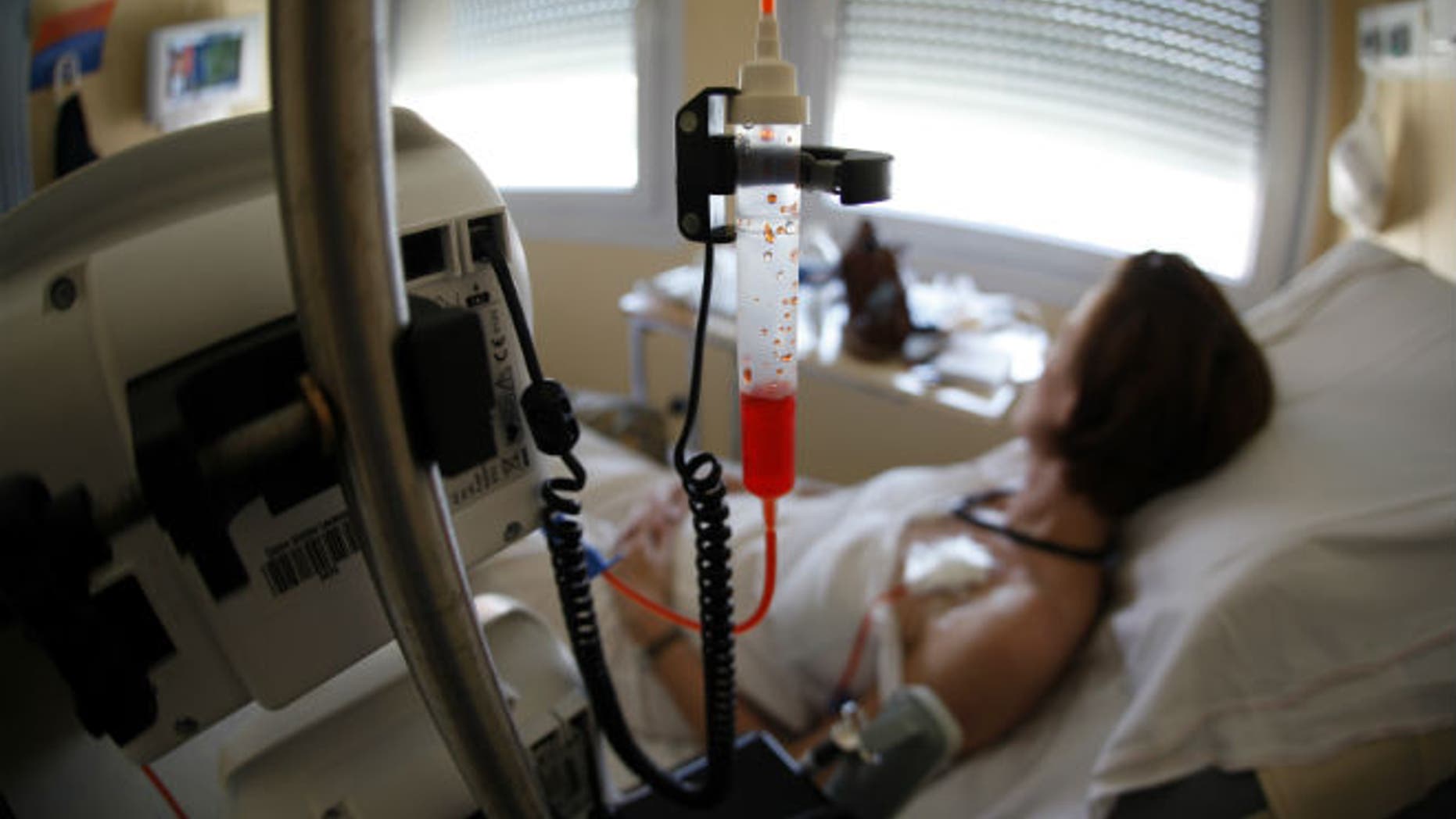 A patient receives chemotherapy treatment for breast cancer in France. (REUTERS/Eric Gaillard)