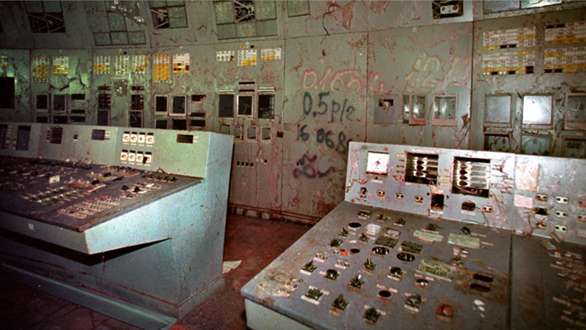 In this Nov. 10, 2000 file photo, the control room, with its damaged machinery, is seen inside reactor No. 4 in the Chernobyl nuclear power plant. Geiger counters registered about 80,000 microroentgens an hour, 16,000 times the safe limit. Reactor No. 4 at the Chernobyl nuclear power plant in Ukraine, then part of the Soviet Union, exploded on April 26, 1986, sending a cloud of radiation over much of Europe. (AP)