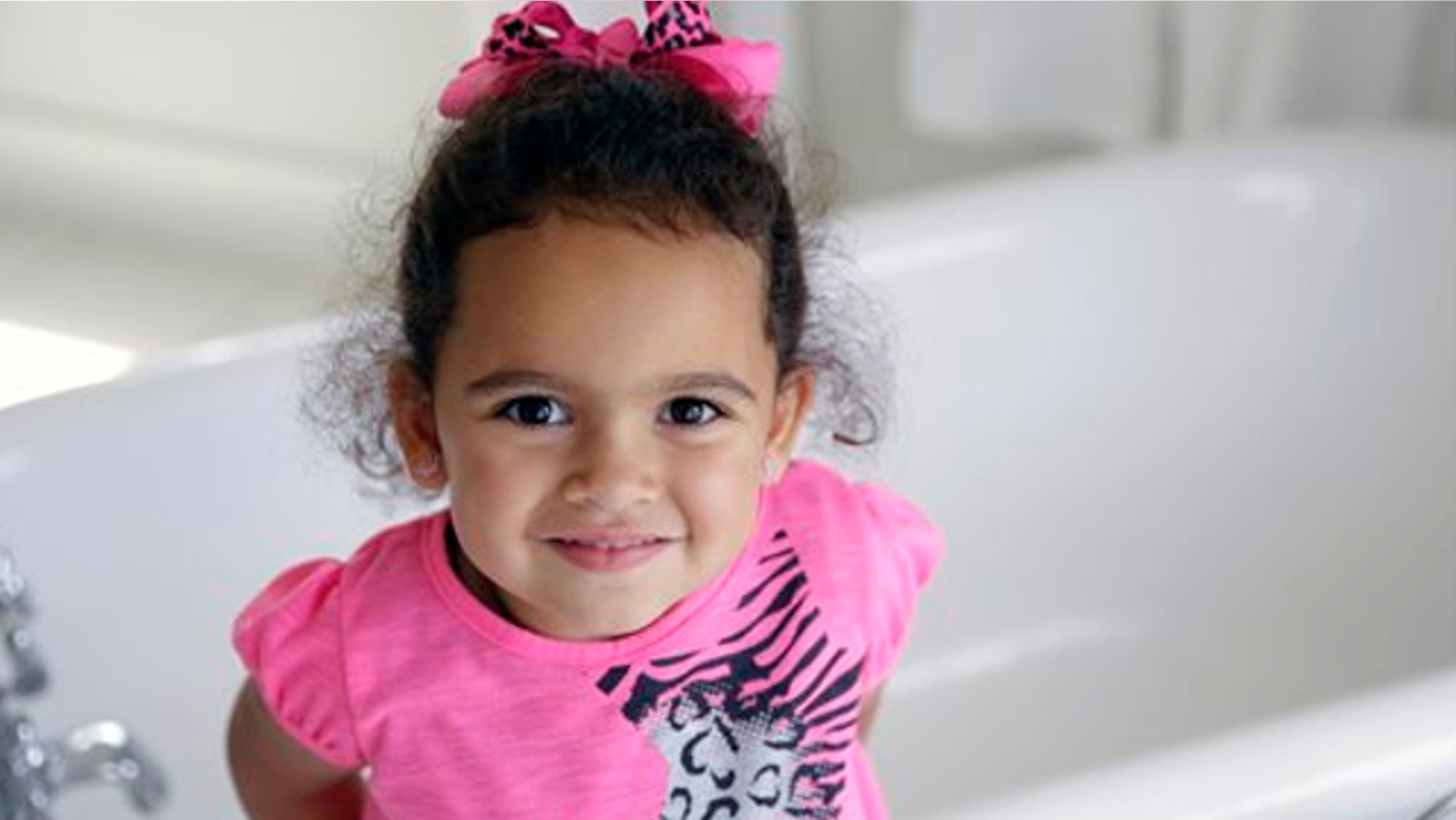 Aug. 6, 2013: Veronica, the 4-year-old Cherokee girl at the center of an adoption dispute, smiles in a bathroom of the Cherokee Nation Jack Brown Center in Tahlequah, Okla.