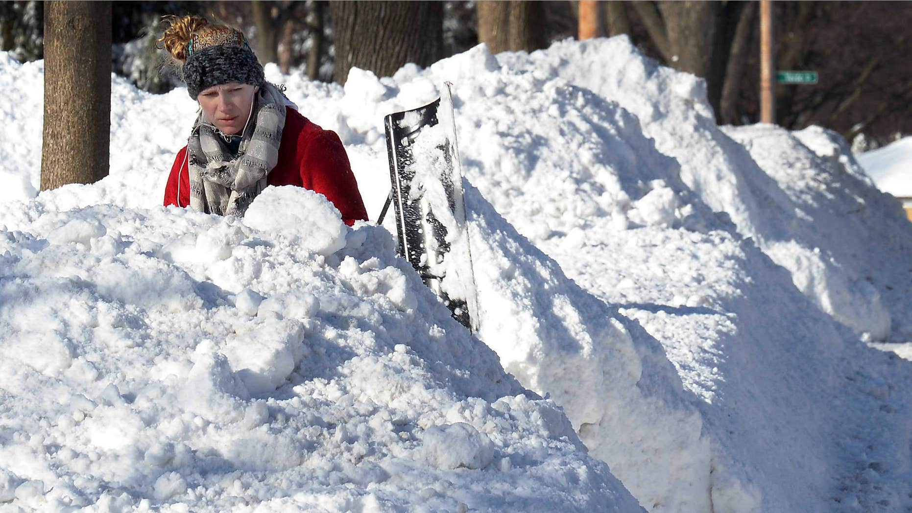 Feb. 2, 2015: Lauren Rosengarden of Mount Prospect, Ill. digs out her driveway.