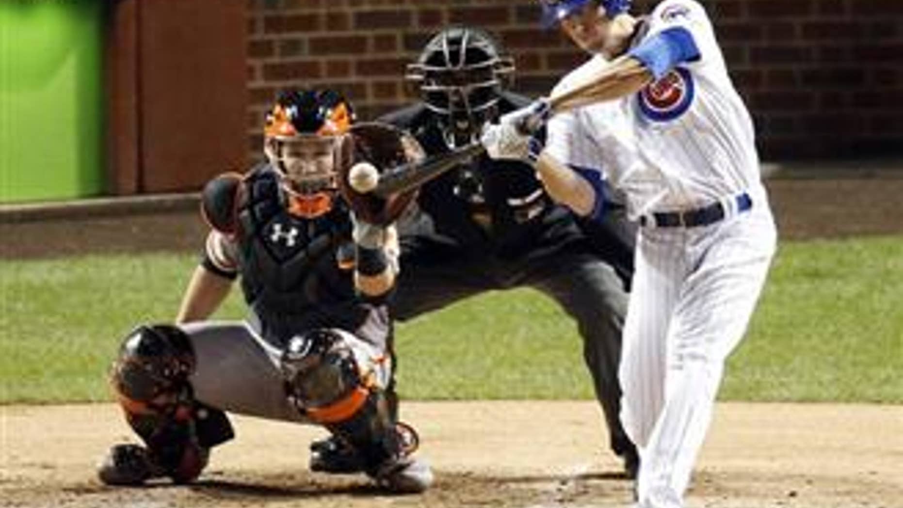 Chicago Cubs' Kris Bryant hits a double in the fourth inning of Game 1 of baseball's National League Division Series against the San Francisco Giants, on Oct. 7, 2016, in Chicago.