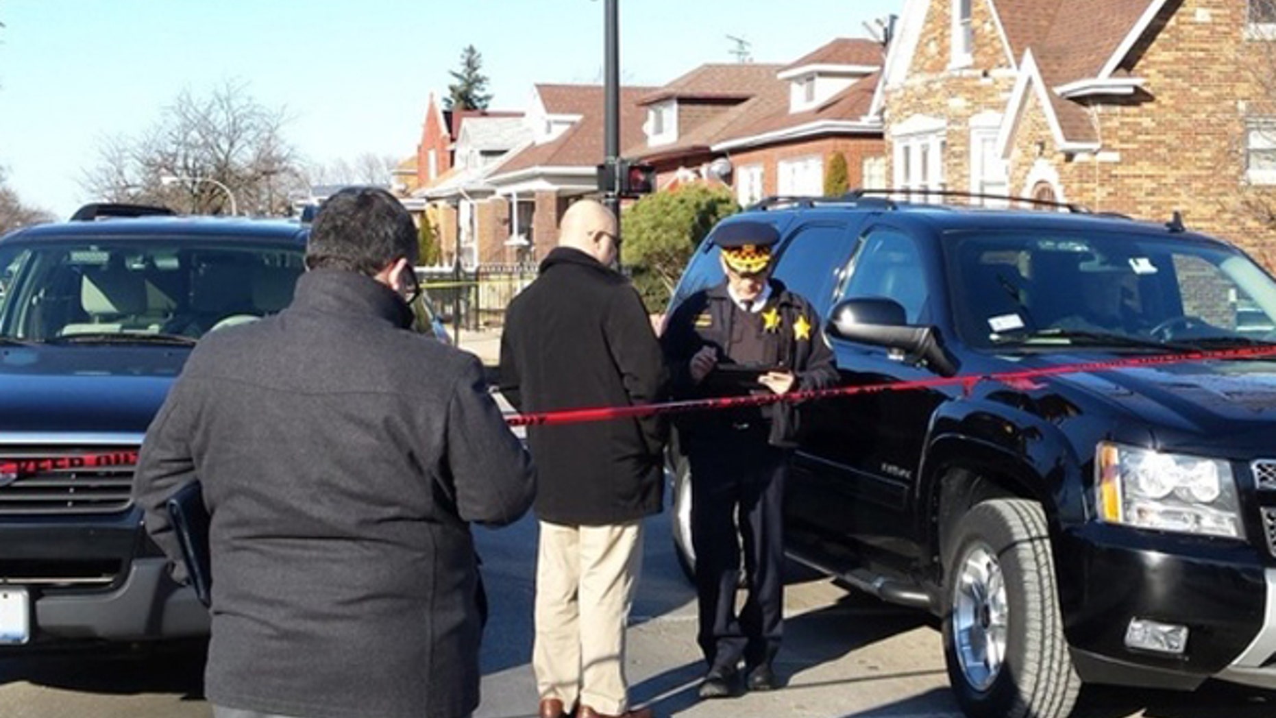 Chicago police at the scene where six people were found dead Thursday afternoon.